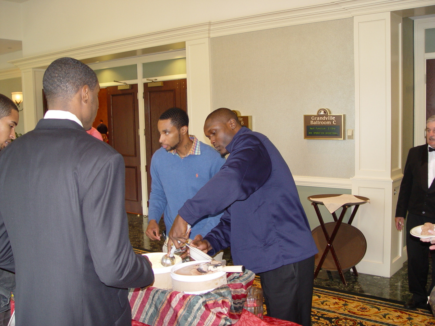 D'Andre Bell helps himself to some ice cream during a break in the media session