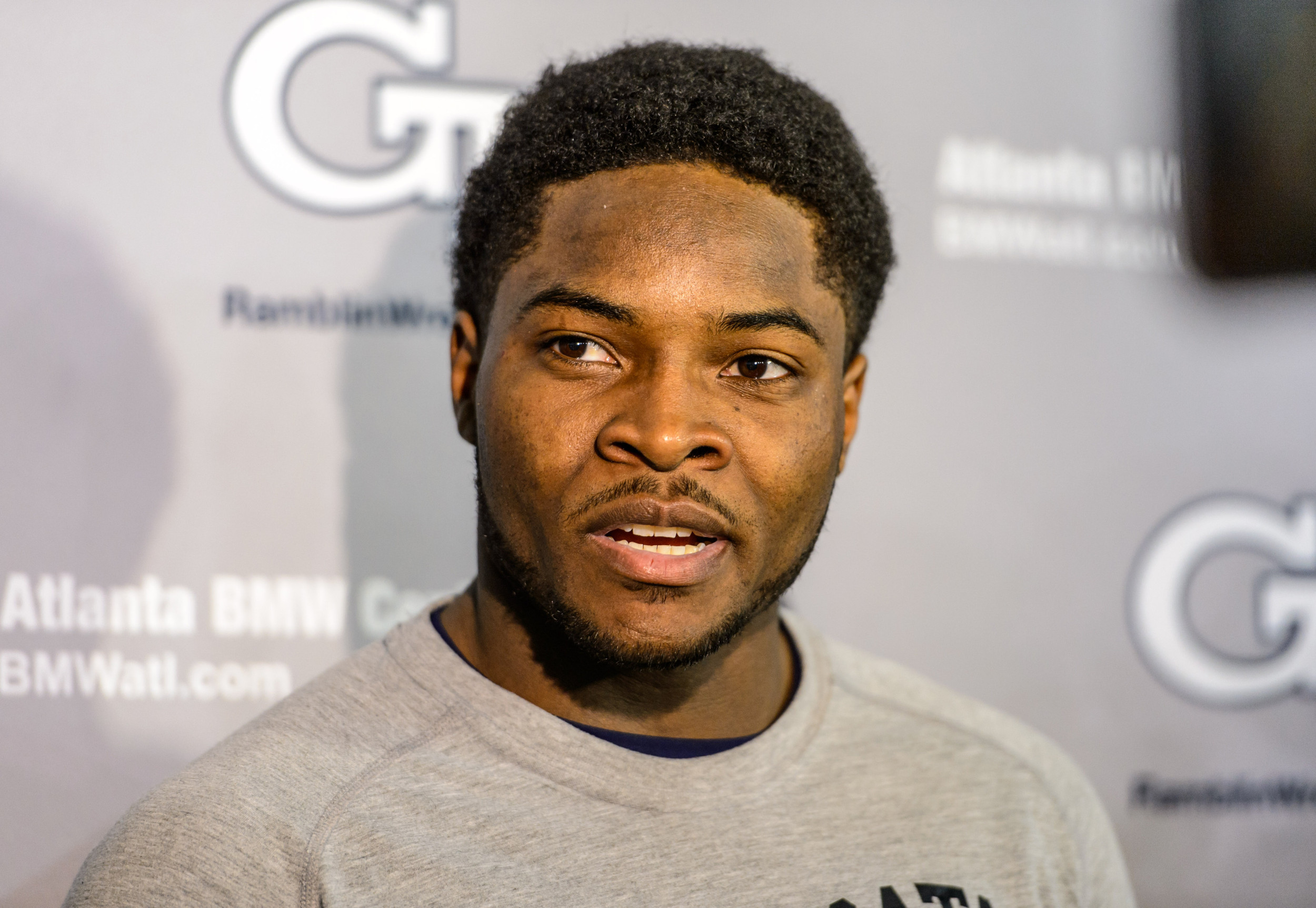 Jamal Golden (4) talks with the media