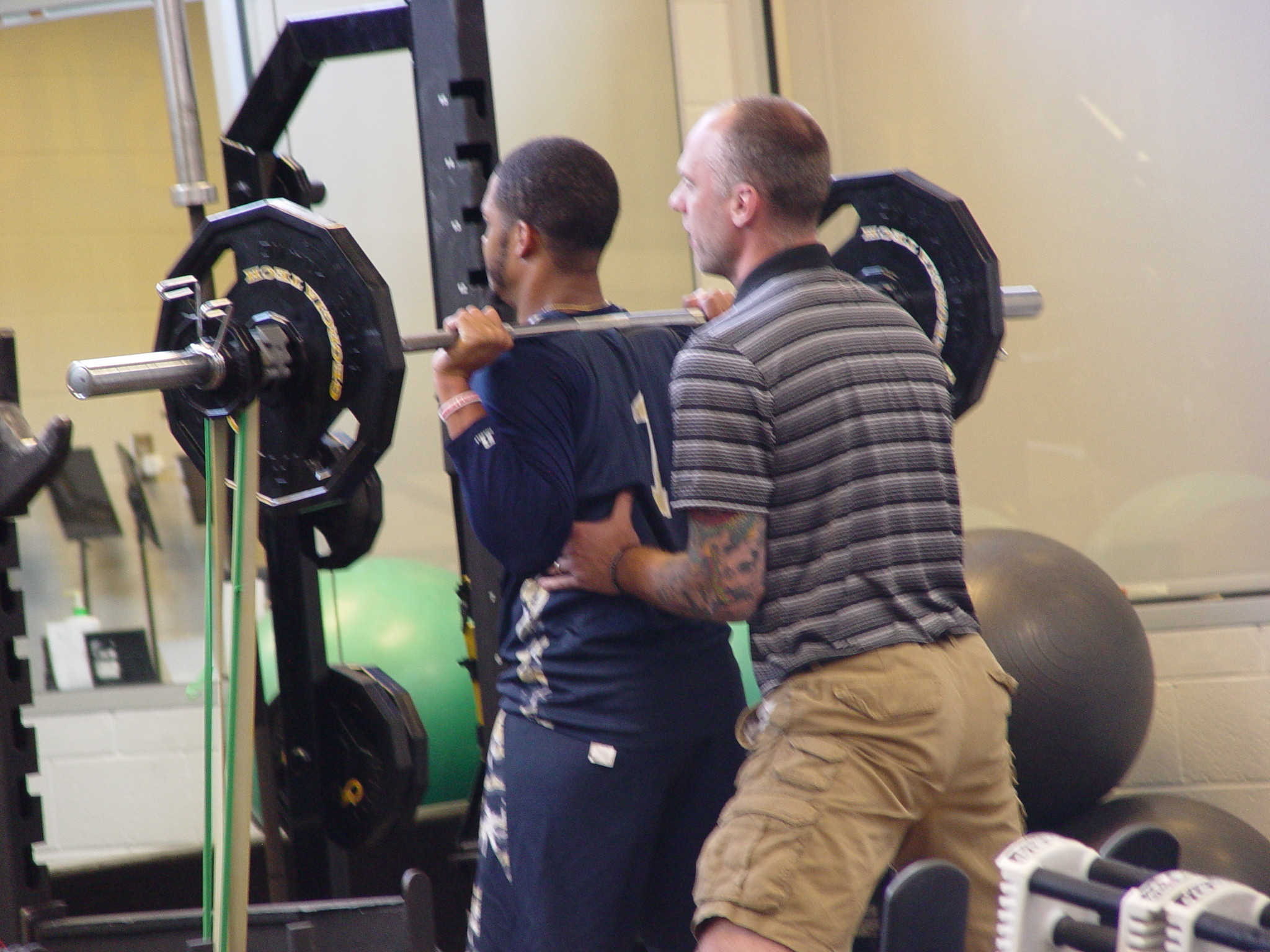 Player development coach Dan Taylor takes the Georgia Tech men's basketball team through a workout on June 16, 2016 in the Zelnak Center weight room.