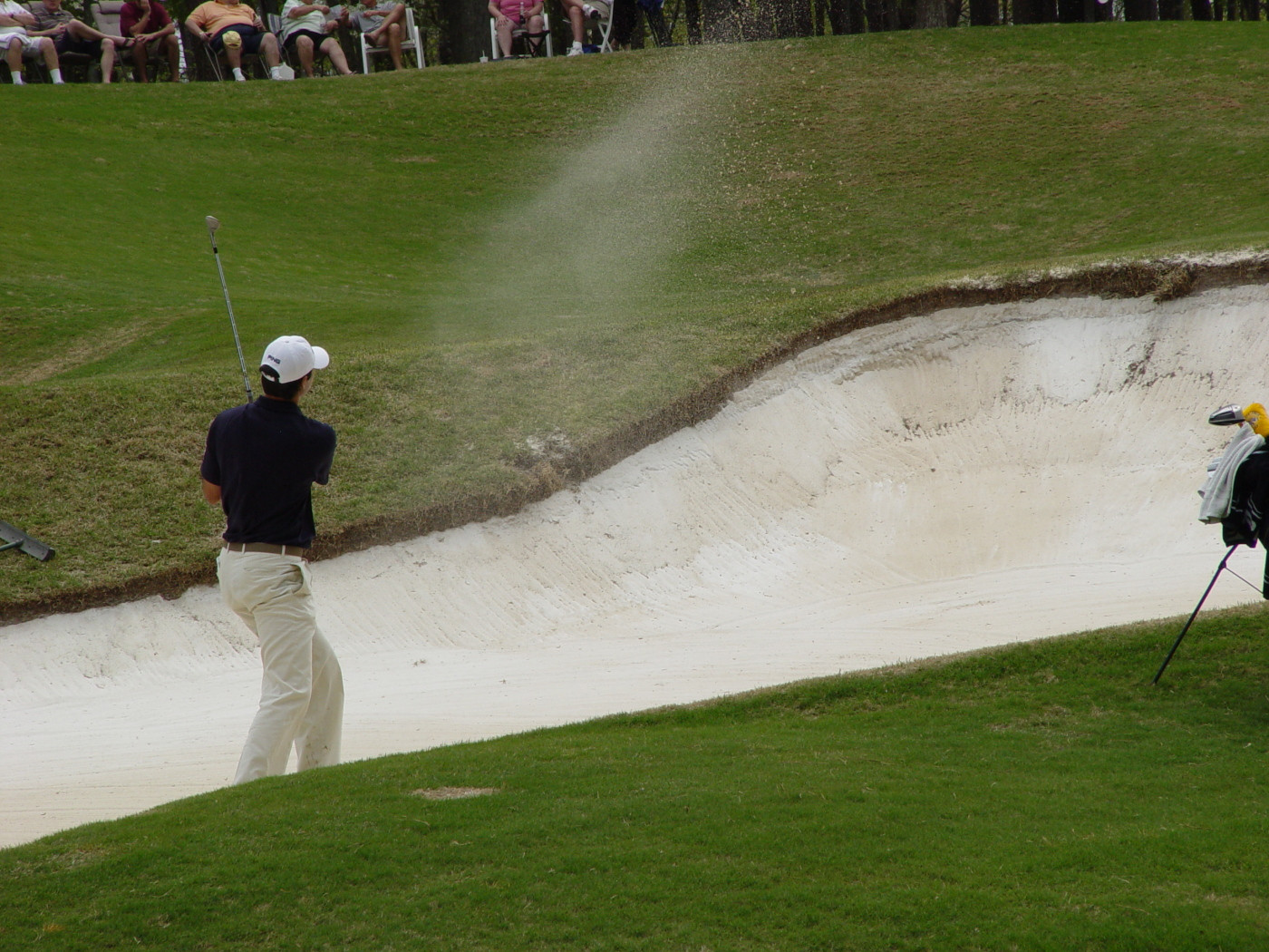 Cameron Tringale hits his third shot from a bunker to the par-5 11th hole during round two of the ACC Golf Championship, April 19, 2008.