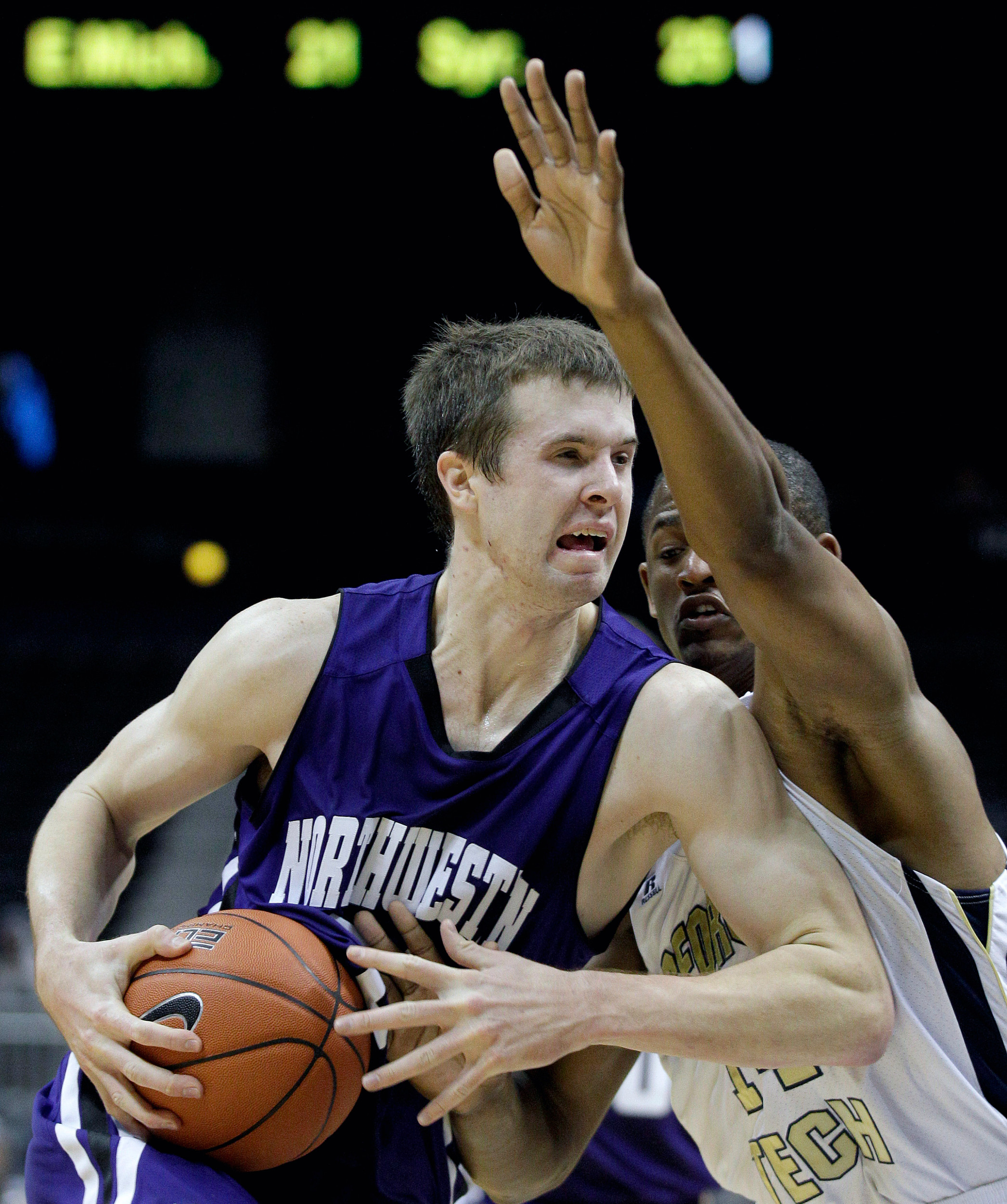 Northwestern forward John Shurna, left, moves to the basket against Georgia Tech guard Jason Morris. (AP Photo/David Goldman)