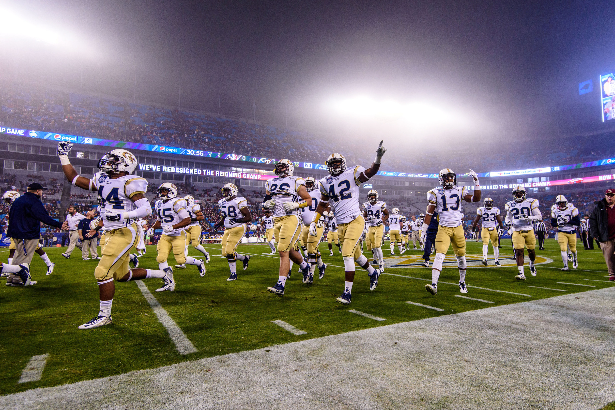 The team runs off the field after warmups.