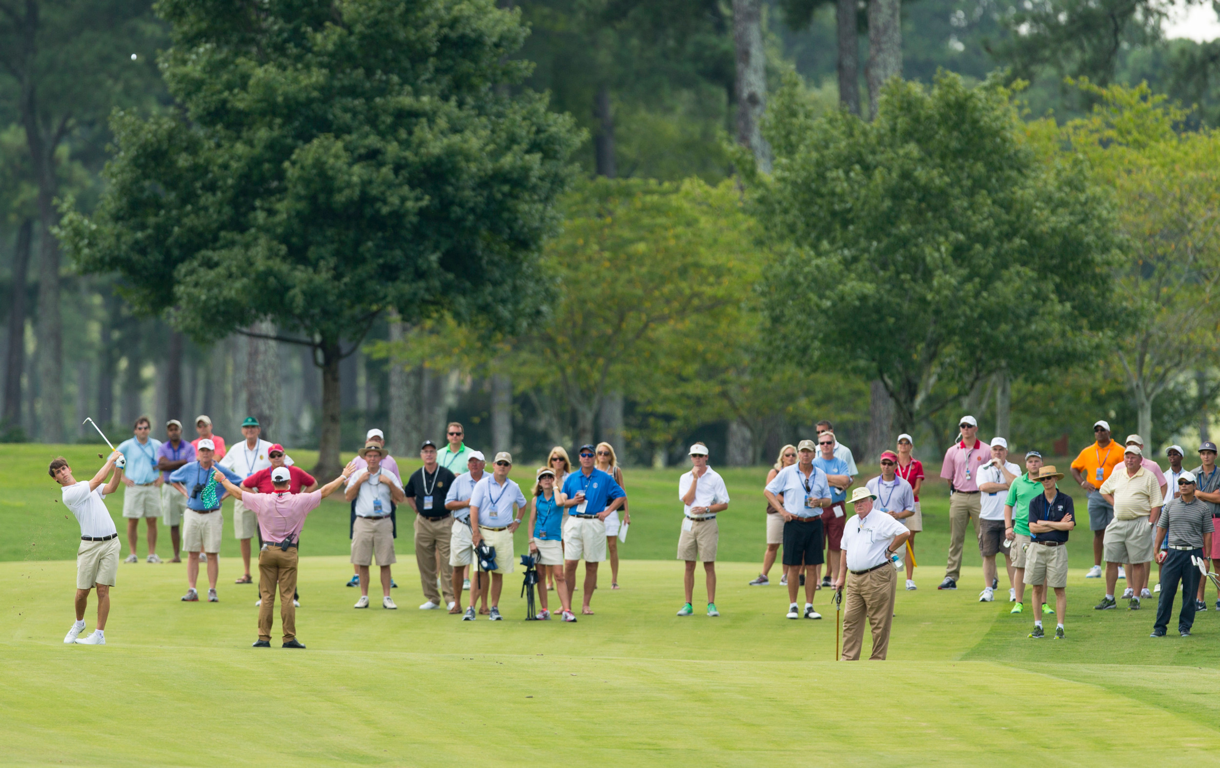 Ollie Schniederjans watches his second shot on the first hole during the third round of match play at the 2014 U.S. Amateur at Atlanta Athletic Club in Johns Creek, Ga. on Thursday, Aug. 14, 2014. (Copyright USGA/Chris Keane)
