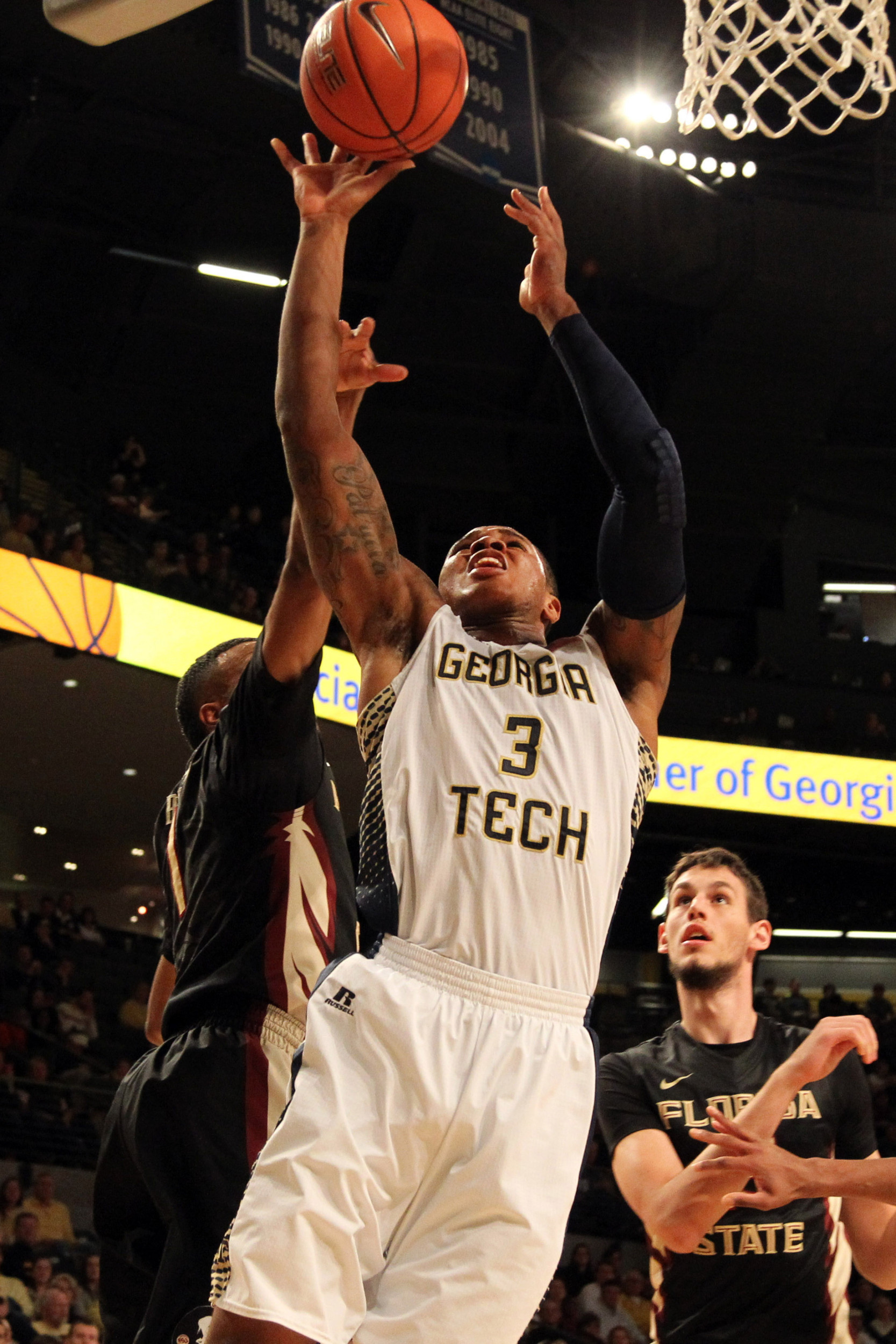 Feb 14, 2015; Atlanta, GA, USA; Georgia Tech Yellow Jackets forward Marcus Georges-Hunt (3) shoots the ball against the Florida State Seminoles in the second half at McCamish Pavilion. Florida State defeated Georgia Tech 57-53.