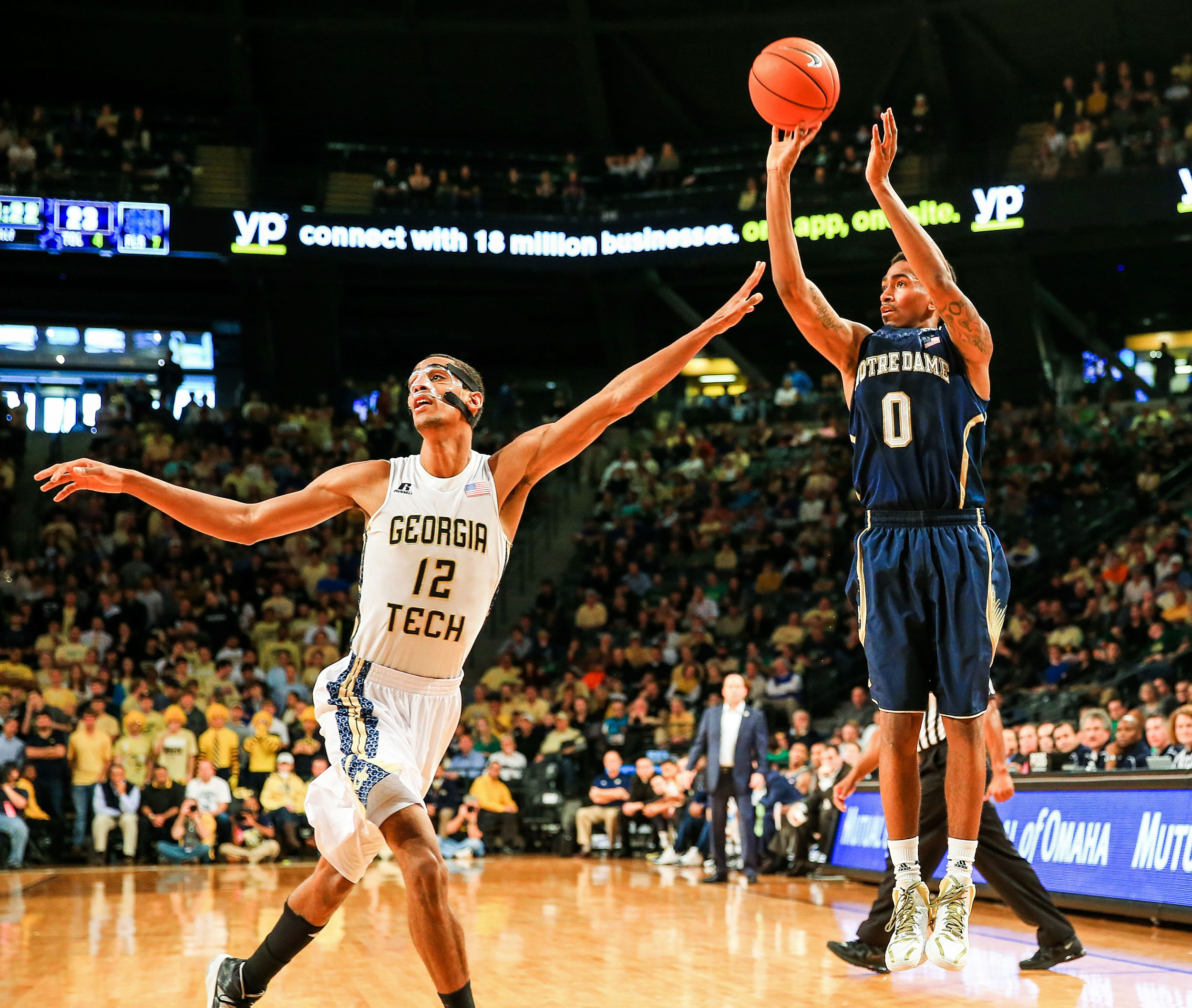 Jan 11, 2014; Atlanta, GA, USA; Notre Dame Fighting Irish guard Eric Atkins (0) shoots over Georgia Tech Yellow Jackets forward Quinton Stephens (12) in the first half at Hank McCamish Pavilion. Mandatory Credit: Daniel Shirey-USA TODAY Sports