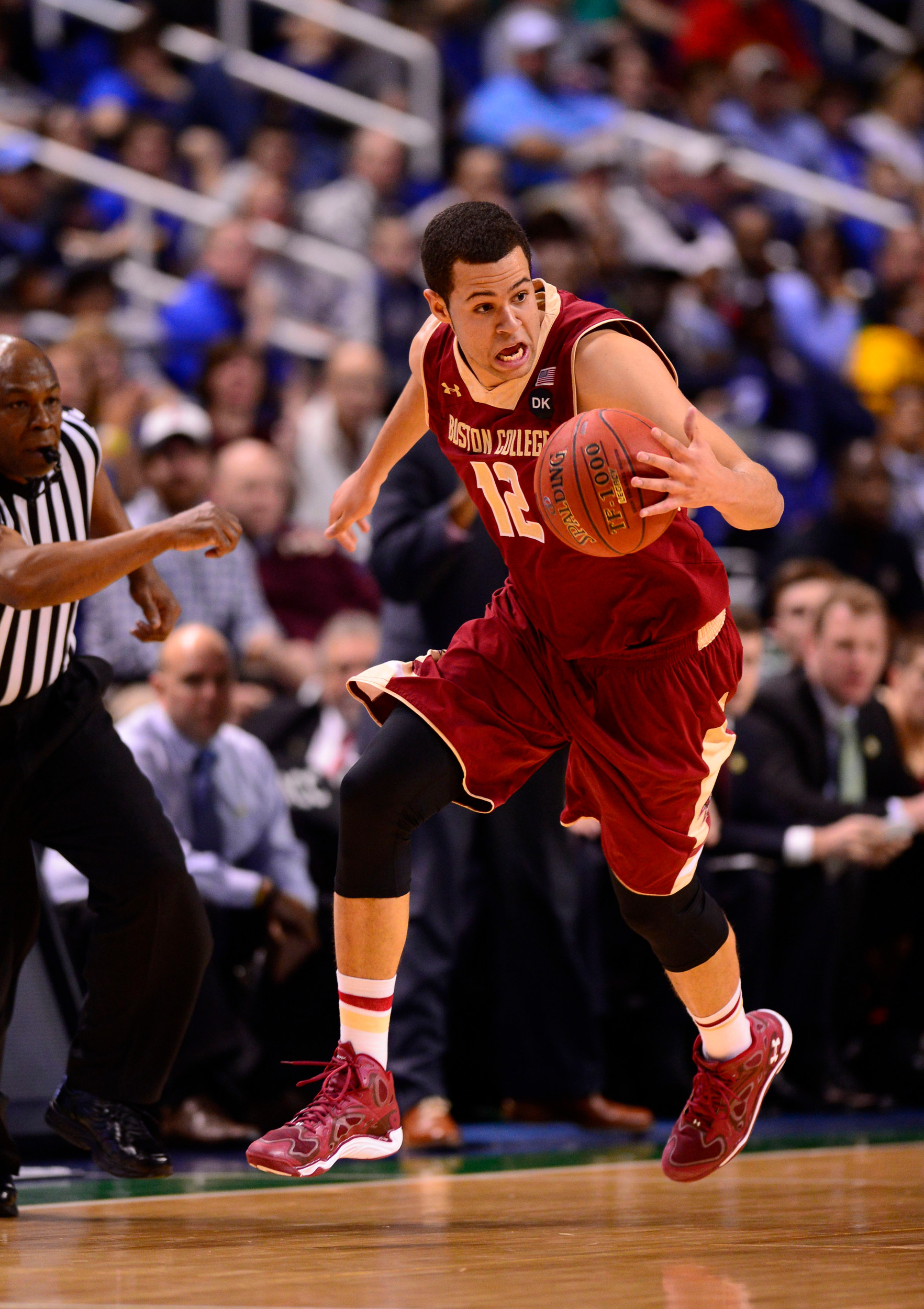 Mar 12, 2014; Greensboro, NC, USA; Boston College Eagles forward Ryan Anderson (12) dribbles in the first half in the first round at Greensboro Coliseum. Mandatory Credit: Bob Donnan-USA TODAY Sports