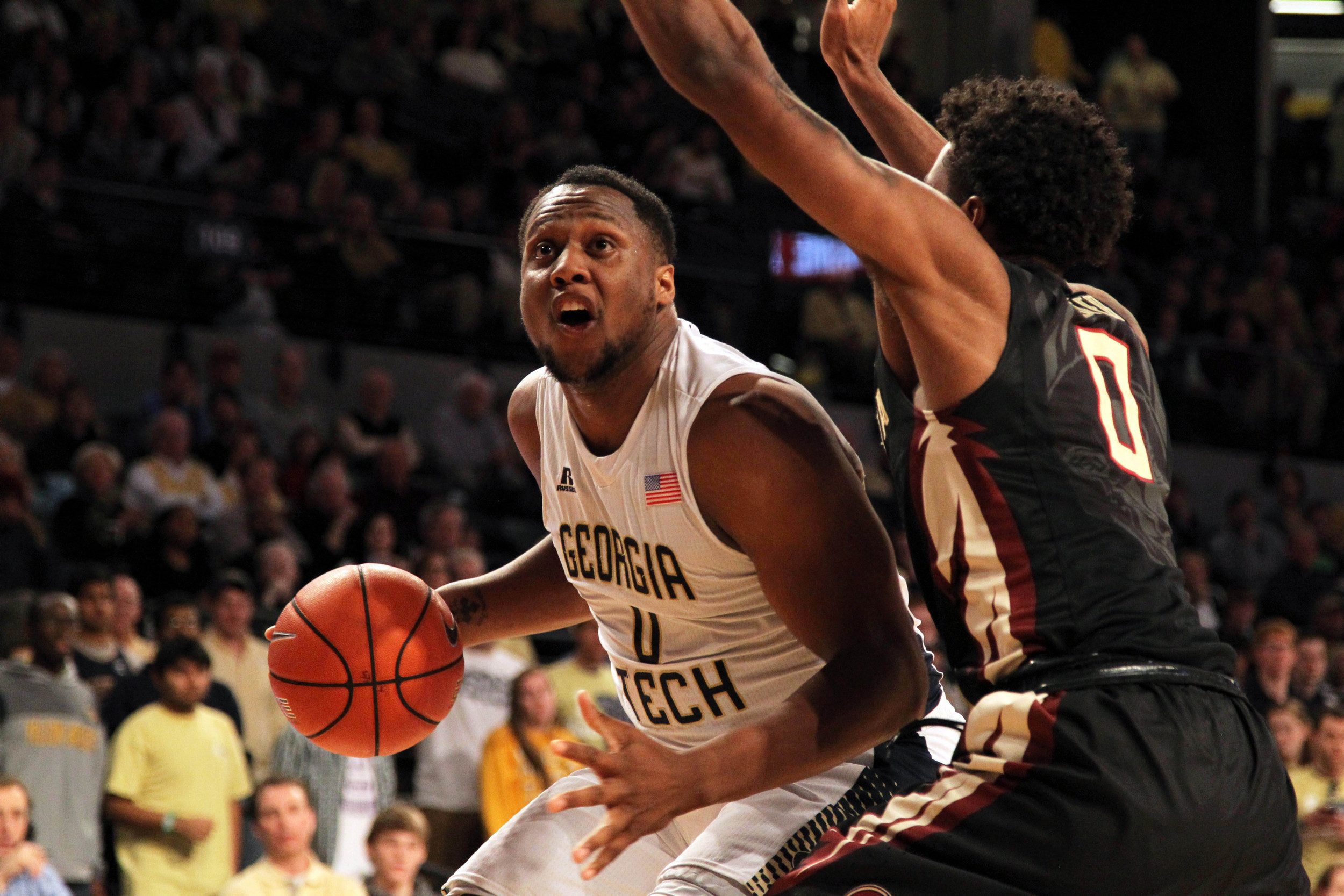 Feb 14, 2015; Atlanta, GA, USA; Georgia Tech Yellow Jackets forward Charles Mitchell (0) drives to the basket against the Florida State Seminoles in the second half at McCamish Pavilion. Florida State defeated Georgia Tech 57-53.