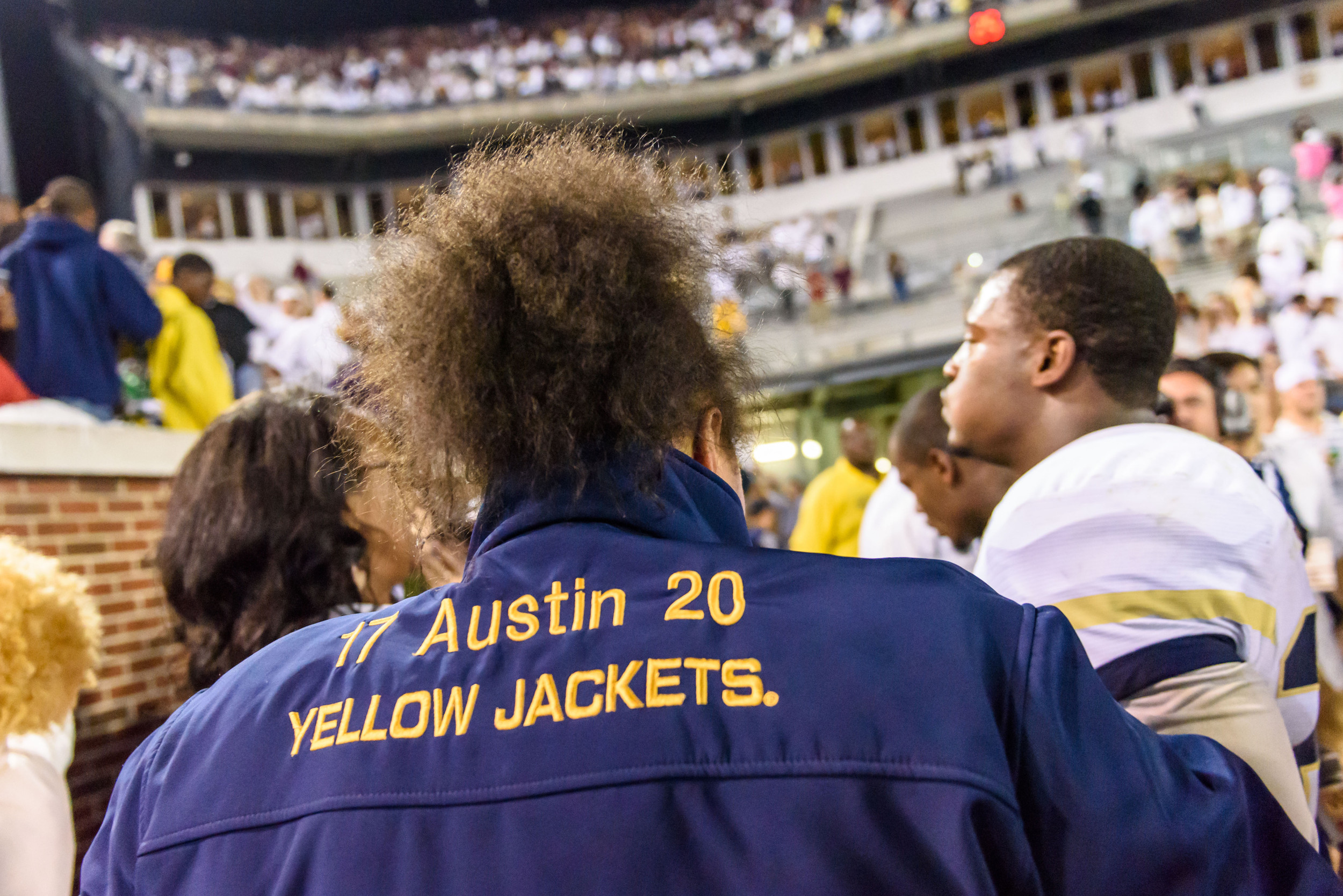 A member of the Austin family shows off her jacket