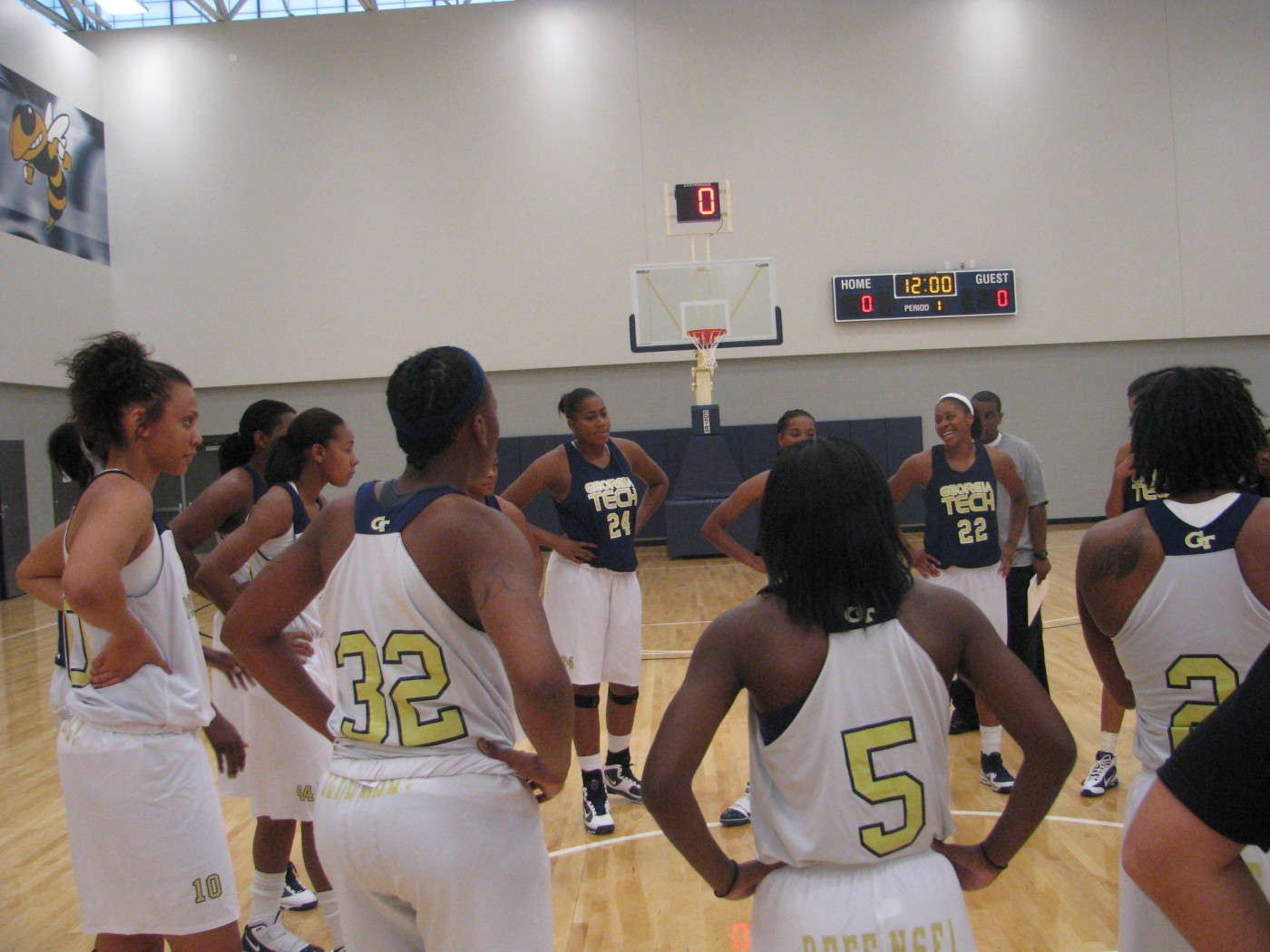 Coach Joseph addresses team before practice on the brand new Zelnak Center floor