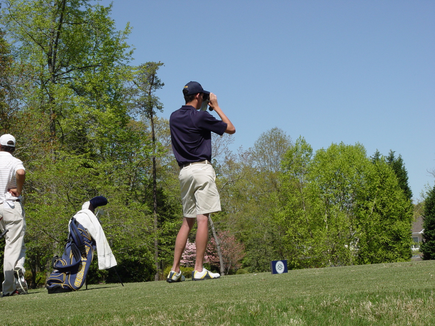 Chesson Hadley checks yardage with his rangefinder at the 14th tee in the first round of ACC Golf Championship - April 17, 2009