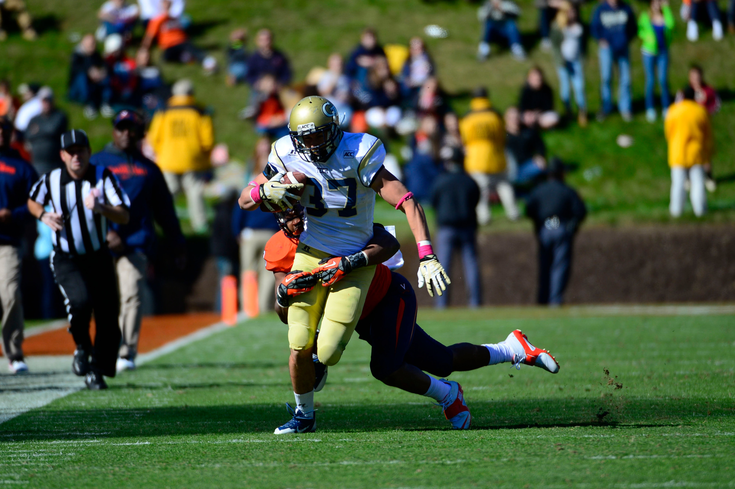 Zach Laskey (37) is tackled by Virginia Cavaliers linebacker Daquan Romero (13). Mandatory Credit: Bob Donnan-USA TODAY Sports