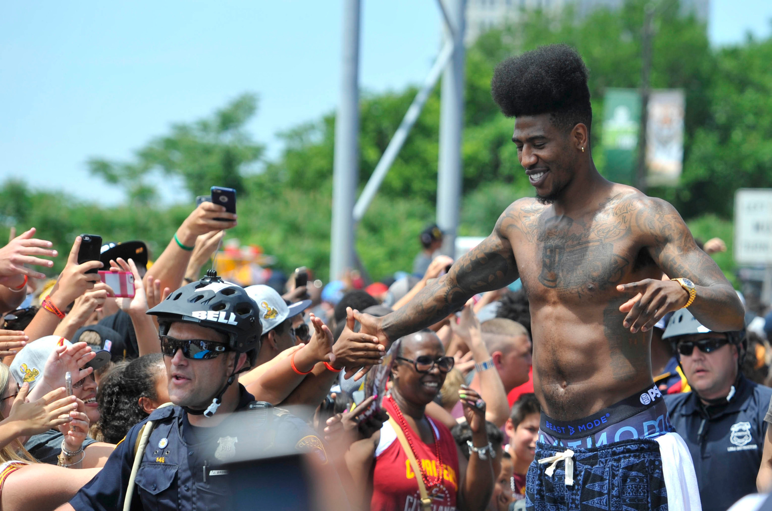 Cleveland Cavaliers guard Iman Shumpert celebrates with fans during the NBA championship parade in downtown Cleveland. Credit: David Richard-USA TODAY Sports