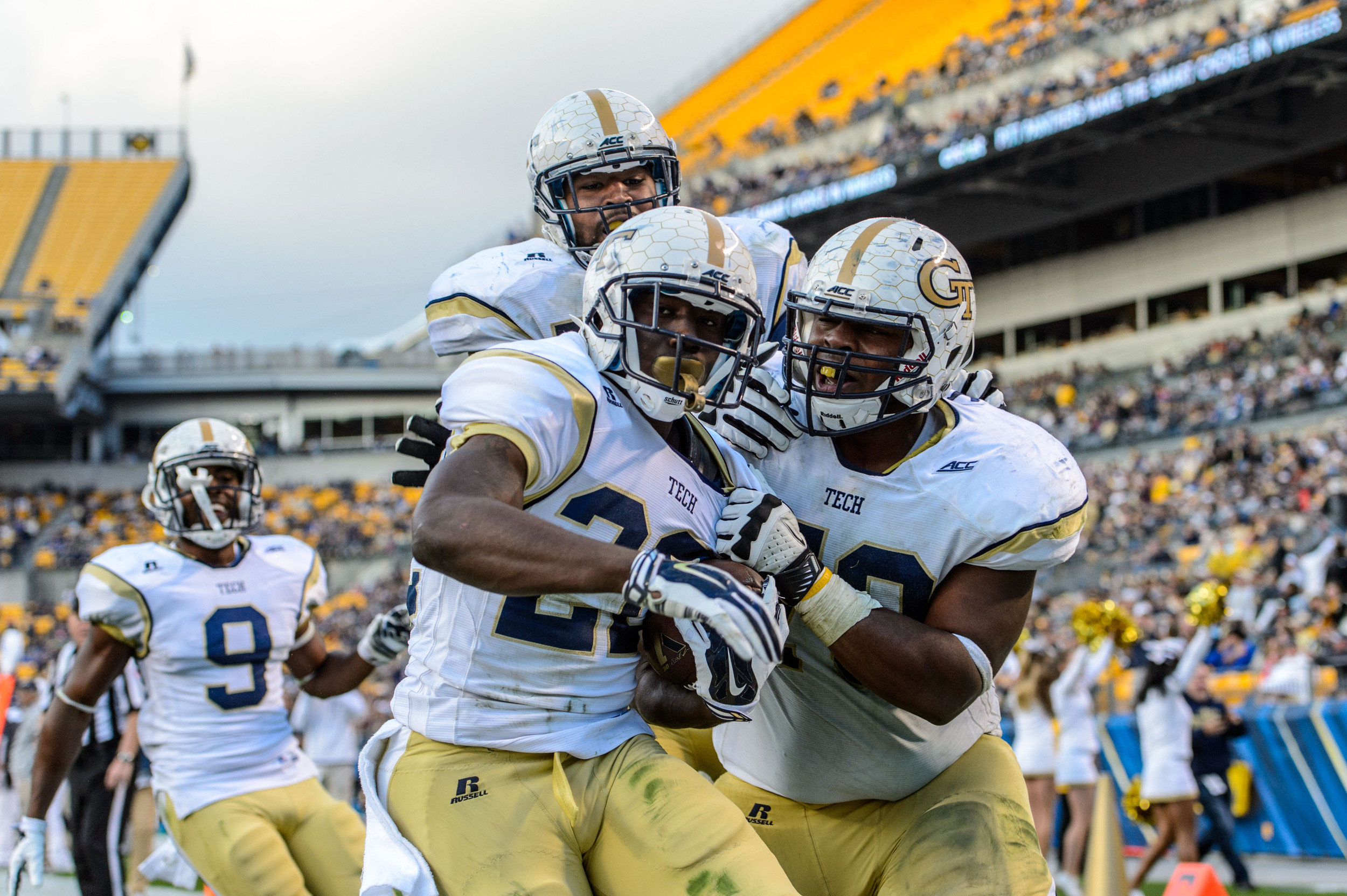 The team celebrates a Broderick Snoddy (22) touchdown!