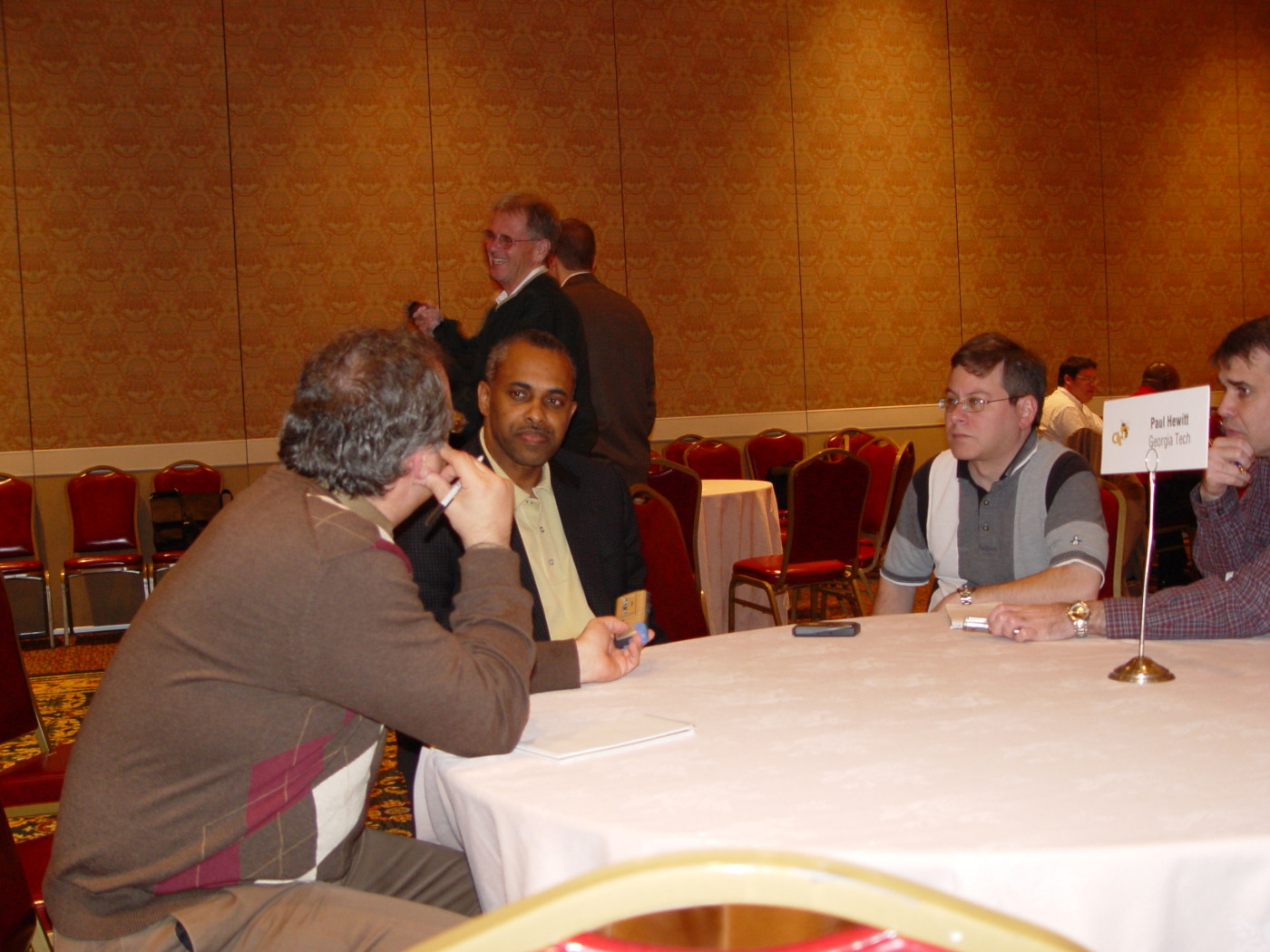 Head coach Paul Hewitt talks about Derrick Favors with Brett Friedlander (left)