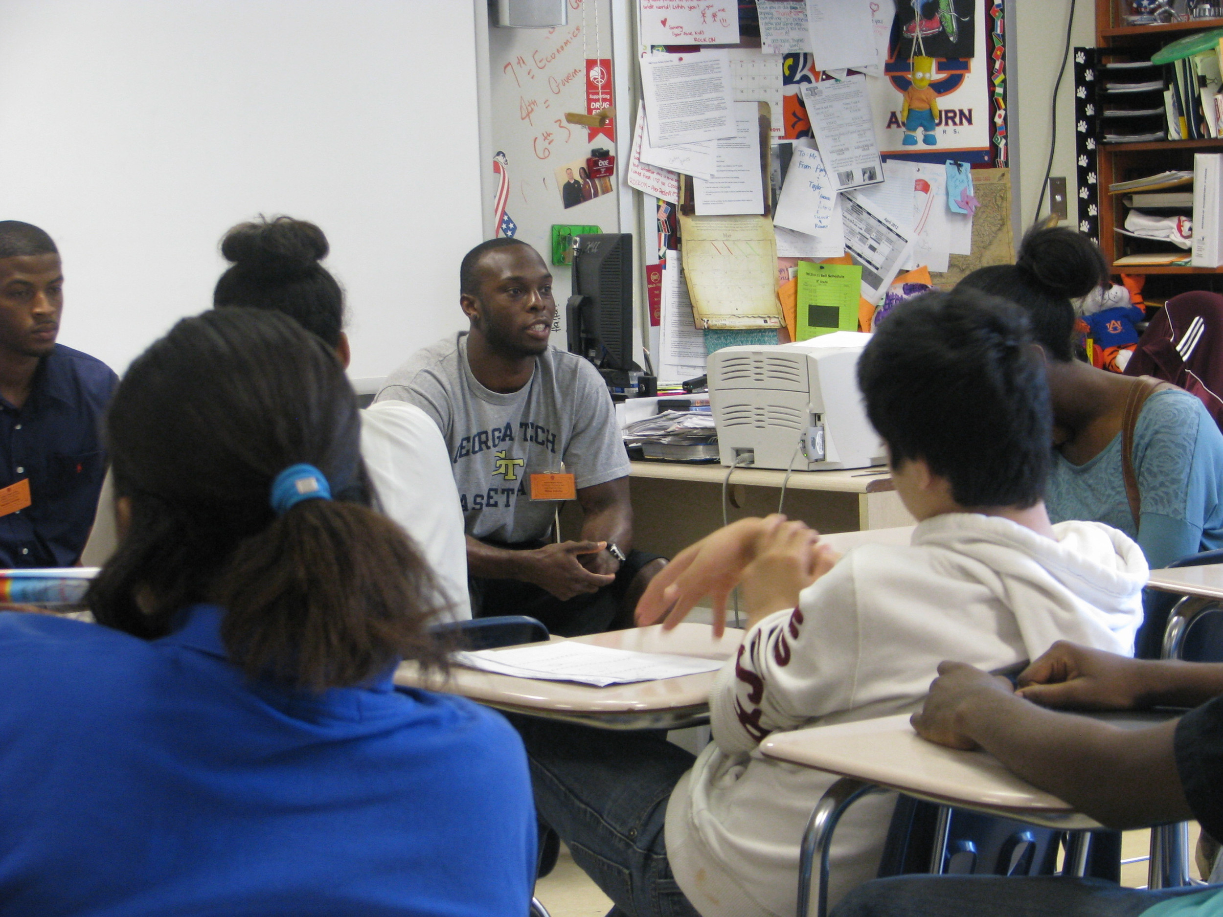 Mfon Udofia joins college students from the area speaking to Tucker Middle School pupils about college life.