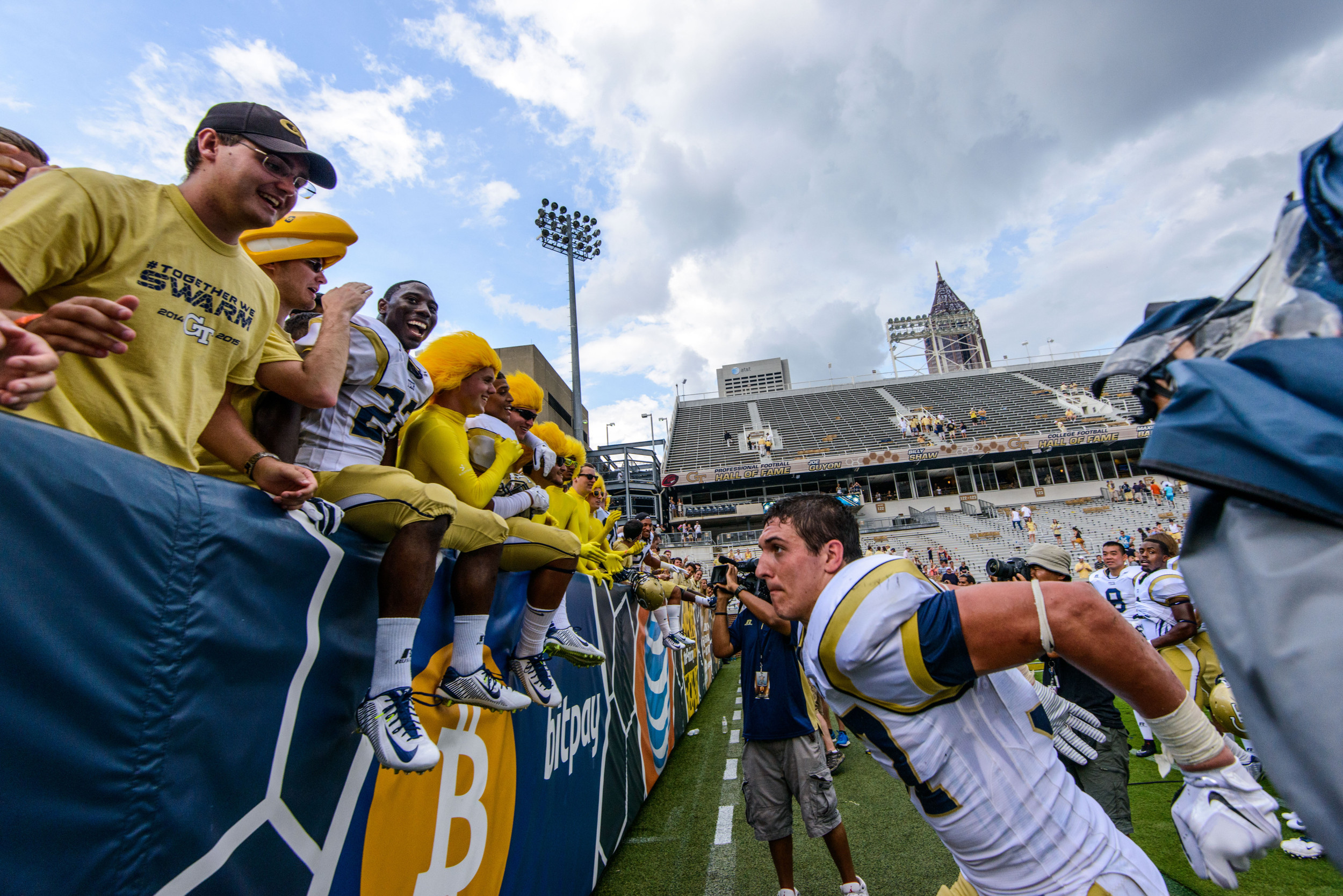 Zach Laskey (37) leaps into the stands to join Broderick Snoddy (22)