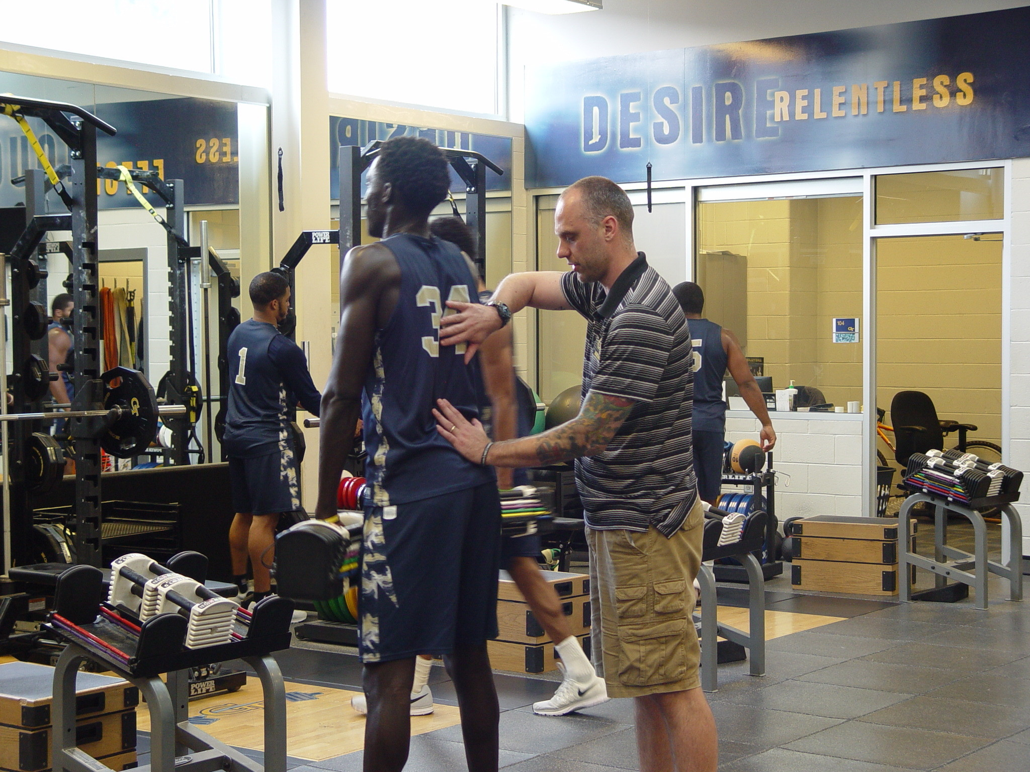 Player development coach Dan Taylor takes the Georgia Tech men's basketball team through a workout on June 16, 2016 in the Zelnak Center weight room.