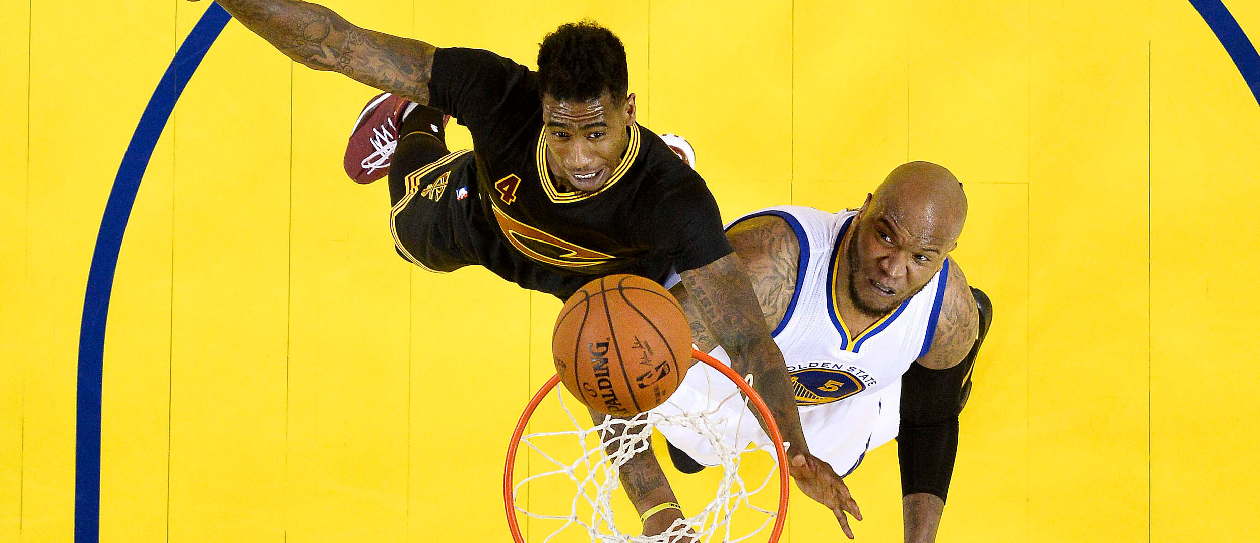 Jun 19, 2016; Oakland, CA, USA; Cleveland Cavaliers guard Iman Shumpert (4) and Golden State Warriors center Festus Ezeli (31) go after a rebound in game seven of the NBA Finals. Credit: John G. Mabanglo-Pool Photo via USA TODAY Sports