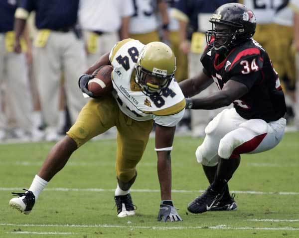Georgia Tech wide receiver Tyler Melton (84) tries to keep his balance after making a reception as Gardner Webb's Philip Peoples defends during the first half.