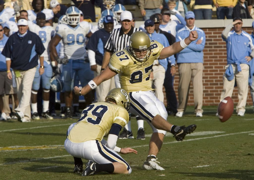 Travis Bell kicks the winning field goal as Durant Brooks holds. Georgia Tech won 27-25. (AP Photo/John Amis)