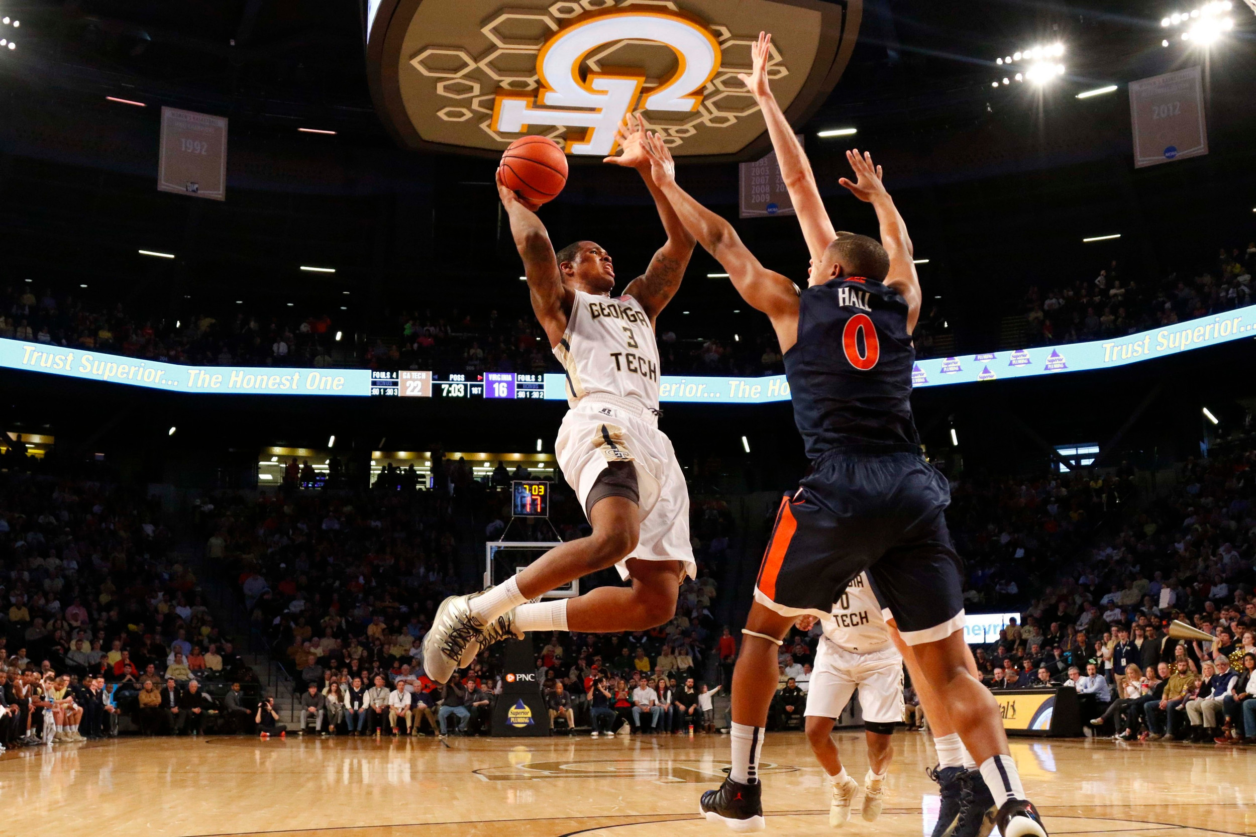 Marcus Georges-Hunt shoots the ball over Virginia Cavaliers guard Devon Hall. Brett Davis-USA TODAY Sports