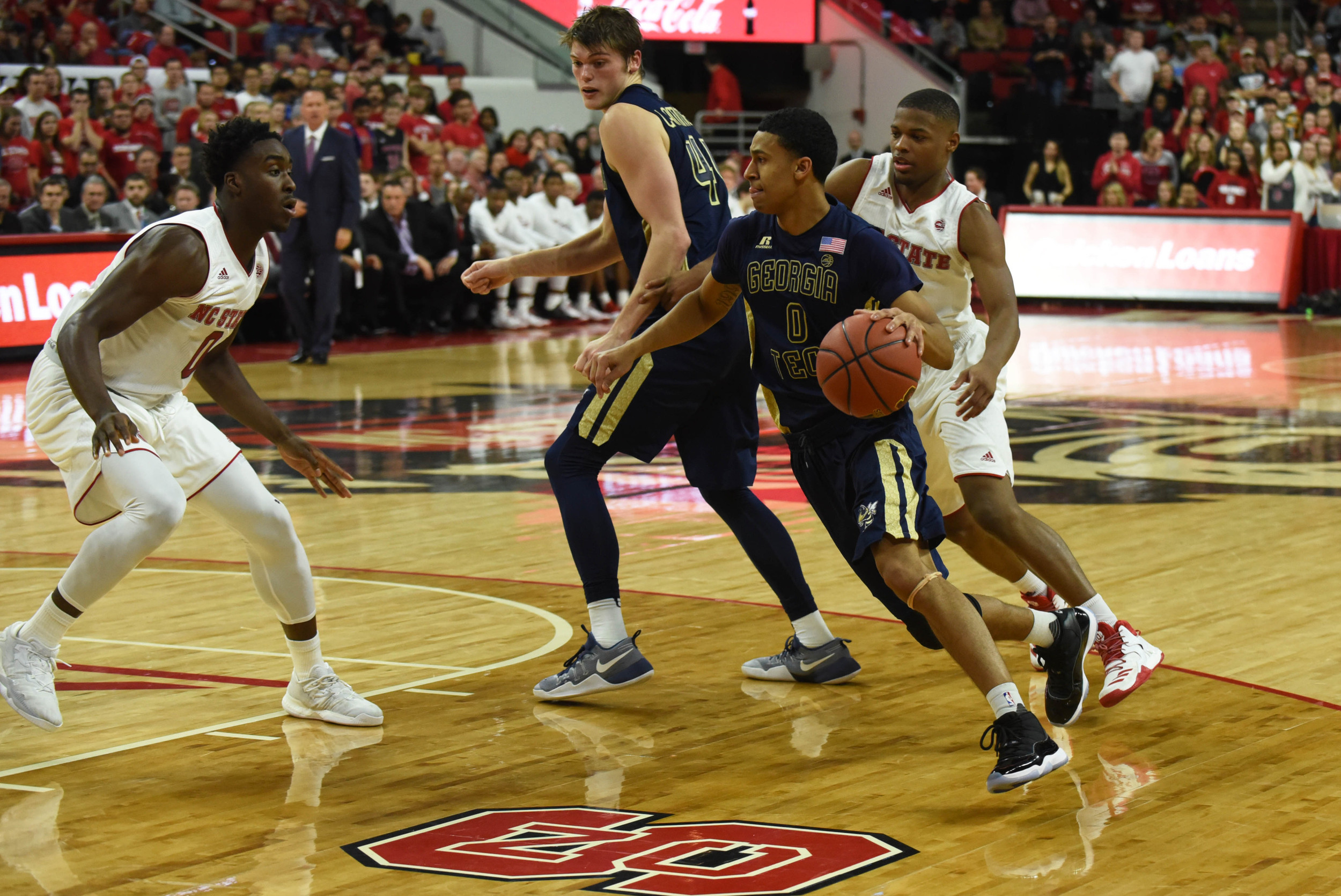 Guard Justin Moore drives to the basket as North Carolina State Wolfpack forward Abdul-Malik Abu defends during the second half. The Yellow Jackets won 86-76. Credit: Rob Kinnan-USA TODAY Sports