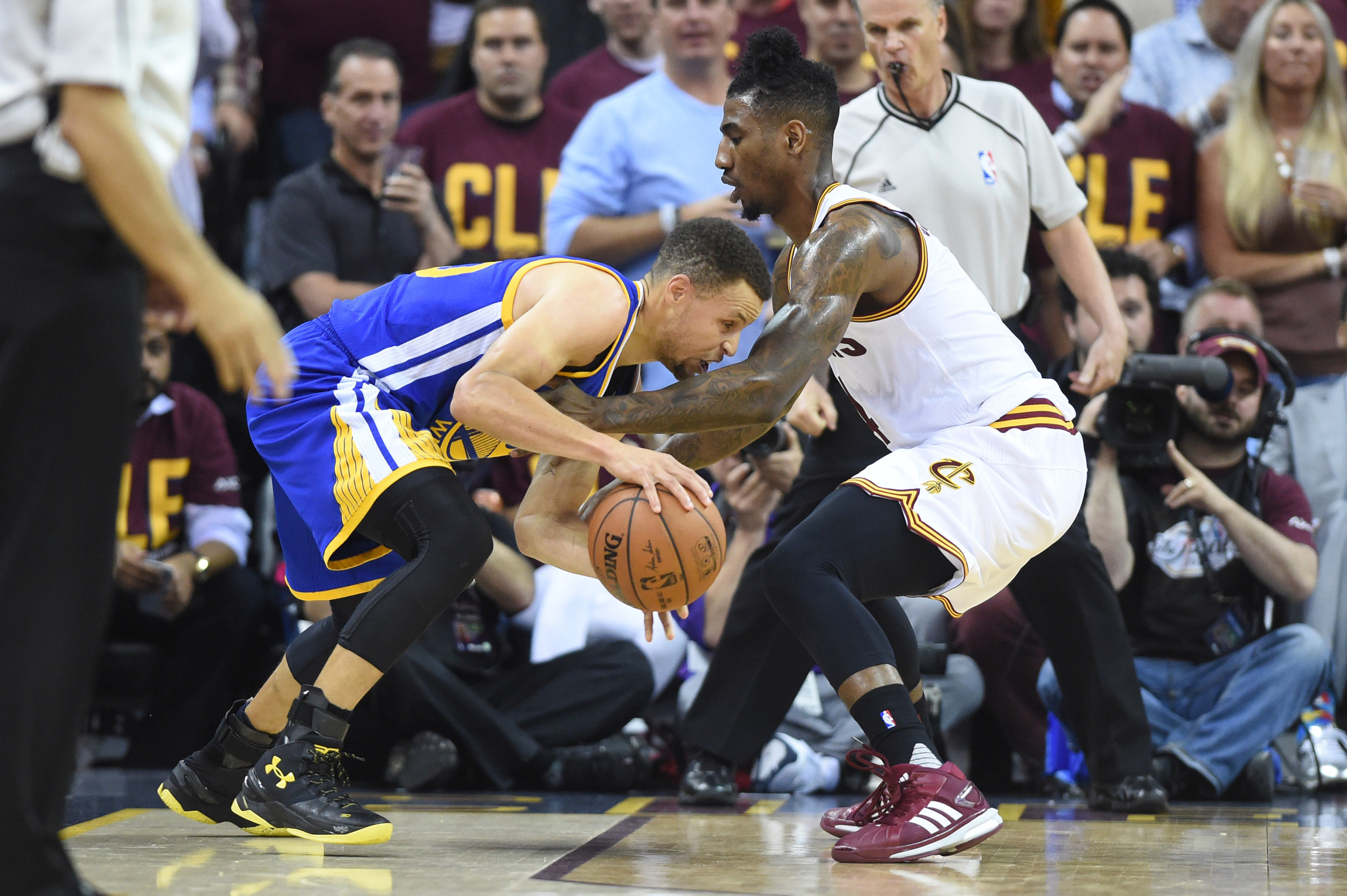 Jun 10, 2016; Cleveland, OH, USA; Golden State Warriors guard Stephen Curry (30) dribbles the ball as Cleveland Cavaliers guard Iman Shumpert (4) defends during game four of the NBA Finals. Credit: Ken Blaze-USA TODAY Sports