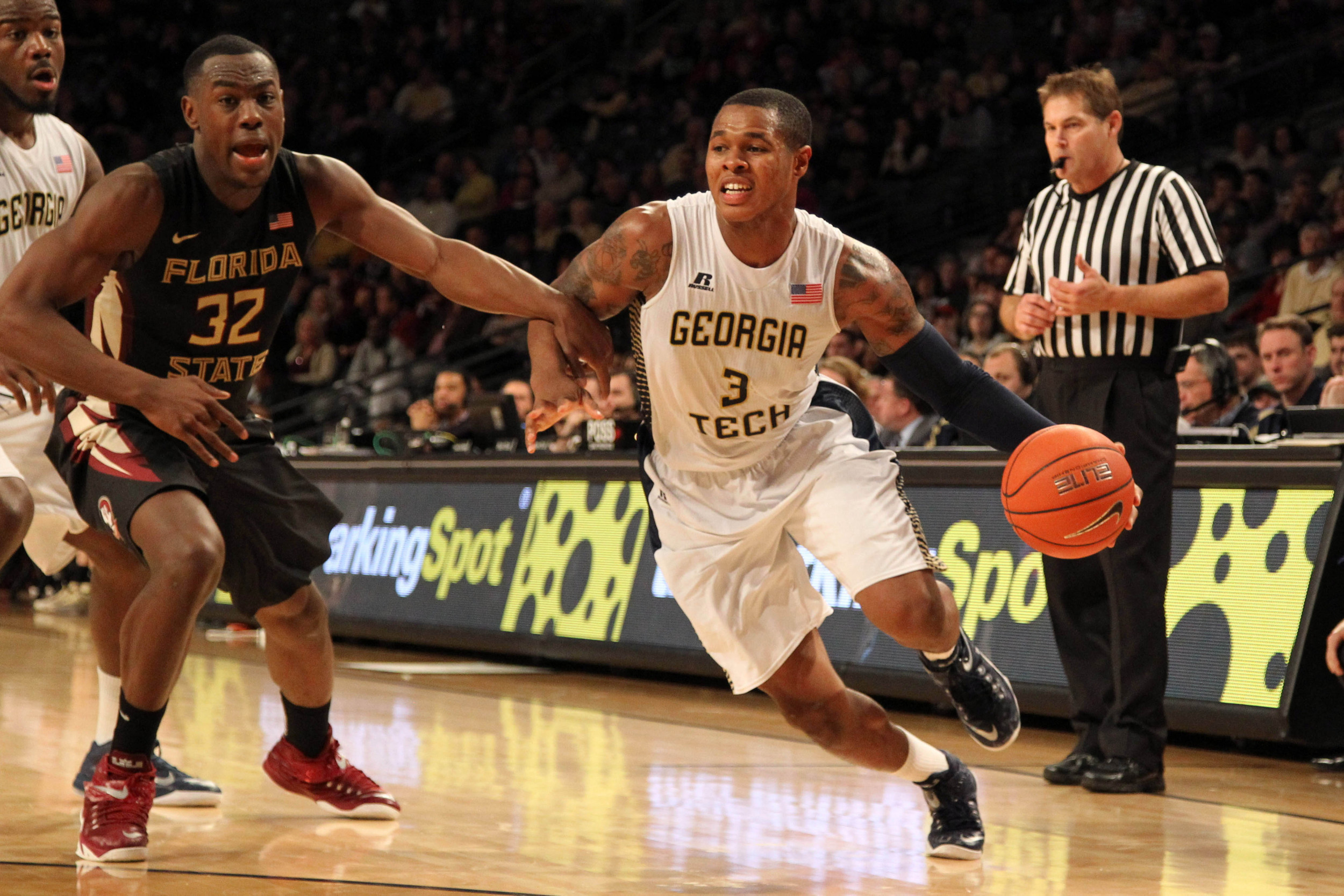 Feb 14, 2015; Atlanta, GA, USA; Georgia Tech Yellow Jackets forward Marcus Georges-Hunt (3) drives past Florida State Seminoles guard Montay Brandon (32) in the second half at McCamish Pavilion. Florida State defeated Georgia Tech 57-53.