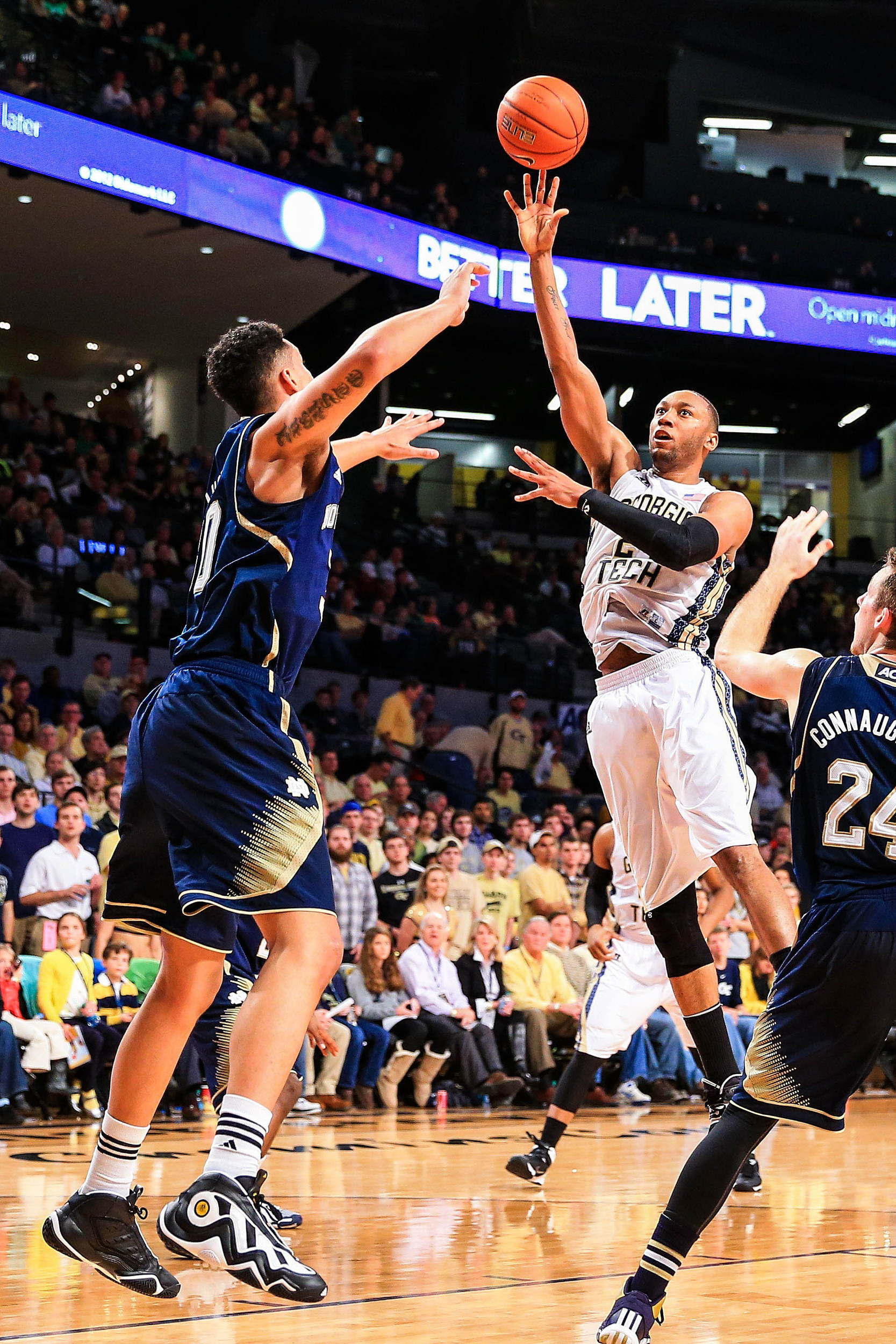 Jan 11, 2014; Atlanta, GA, USA; Georgia Tech Yellow Jackets forward Kammeon Holsey (24) shoots a basket over Notre Dame Fighting Irish forward Zach Auguste (30) in the second half at Hank McCamish Pavilion. Georgia Tech won 74-69. Mandatory Credit: Daniel Shirey-USA TODAY Sports