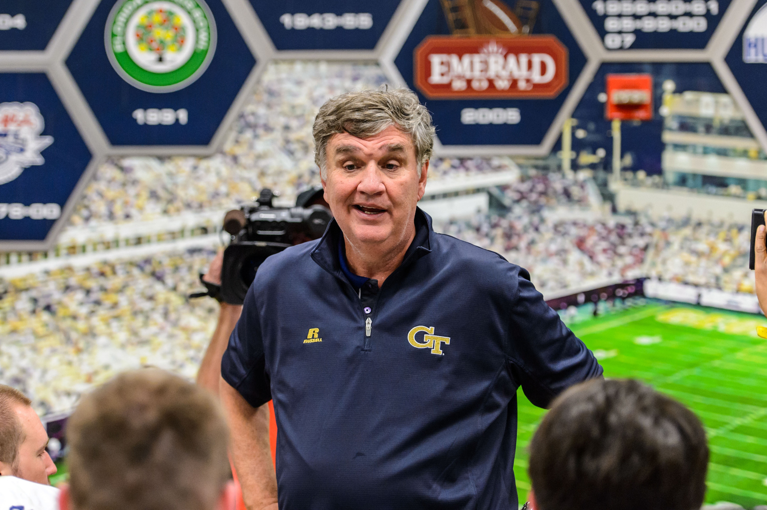 Coach Paul Johnson talks to the team after the upset victory