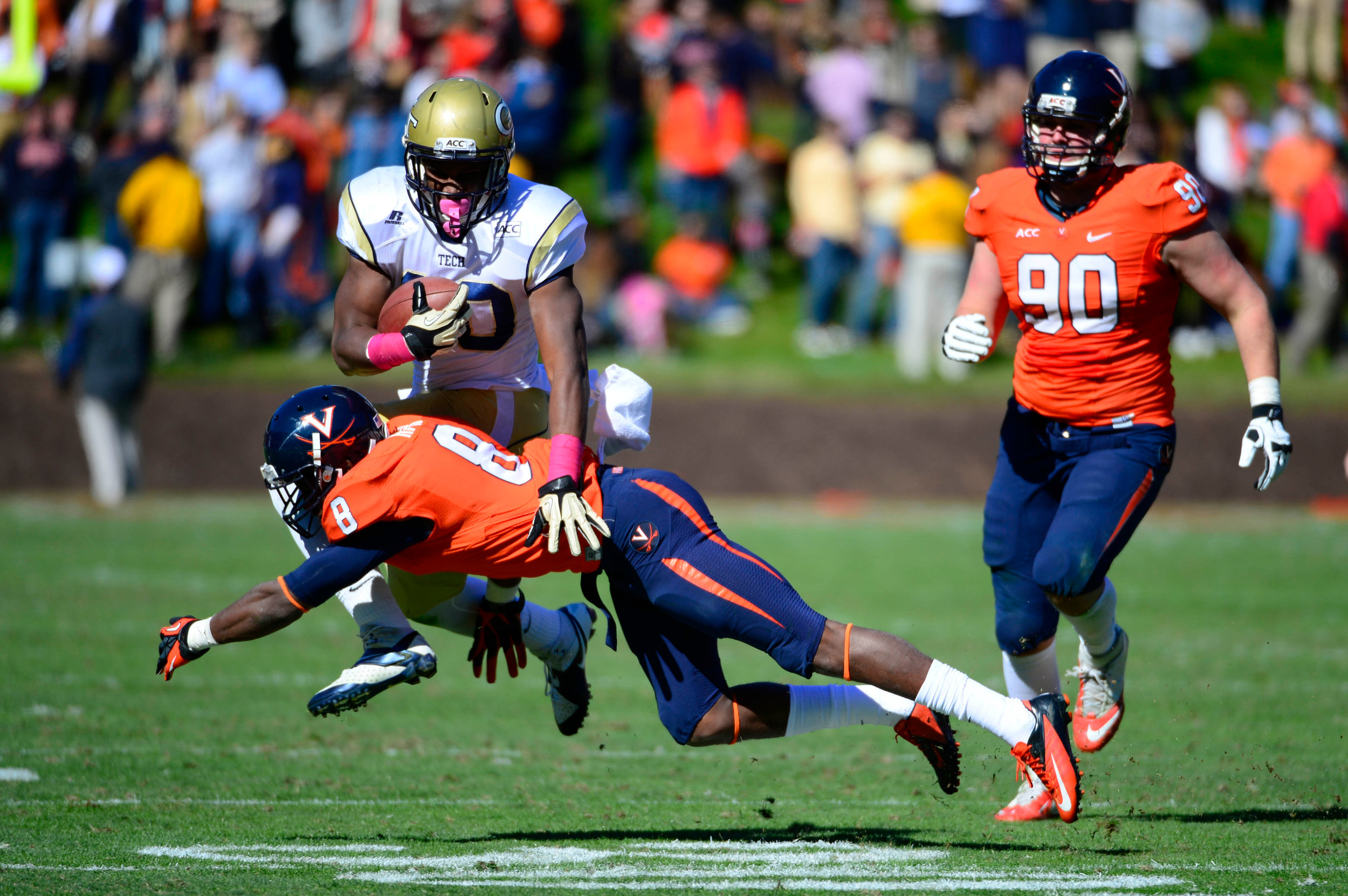Synjyn Days (10) is tackled by Virginia Cavaliers safety Anthony Harris (8) as defensive end Jake Snyder (90) looks on. Mandatory Credit: Bob Donnan-USA TODAY Sports