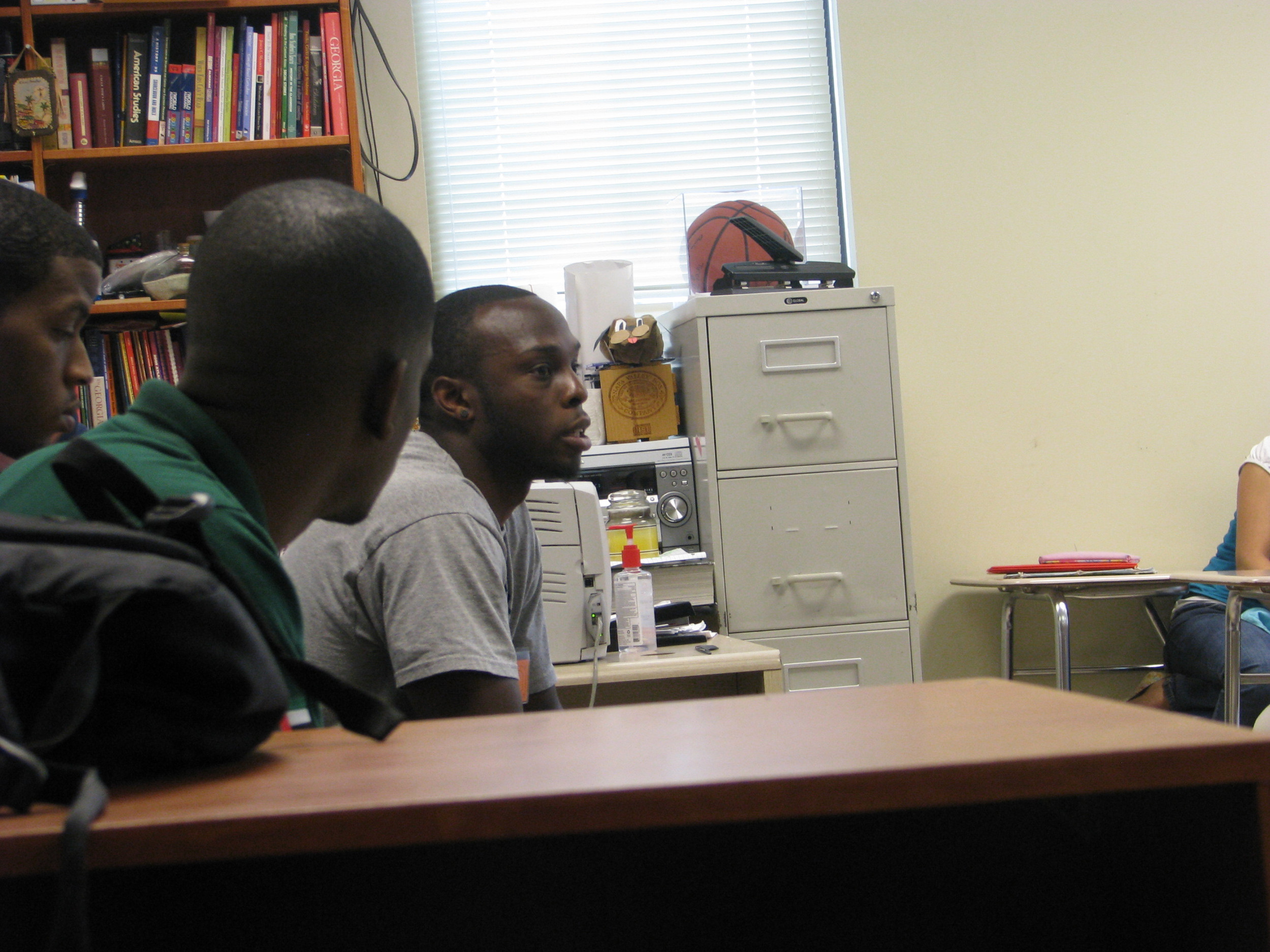 Mfon Udofia joins other college students from the area to speak to Tucker Middle School students about college life and preparing for college.