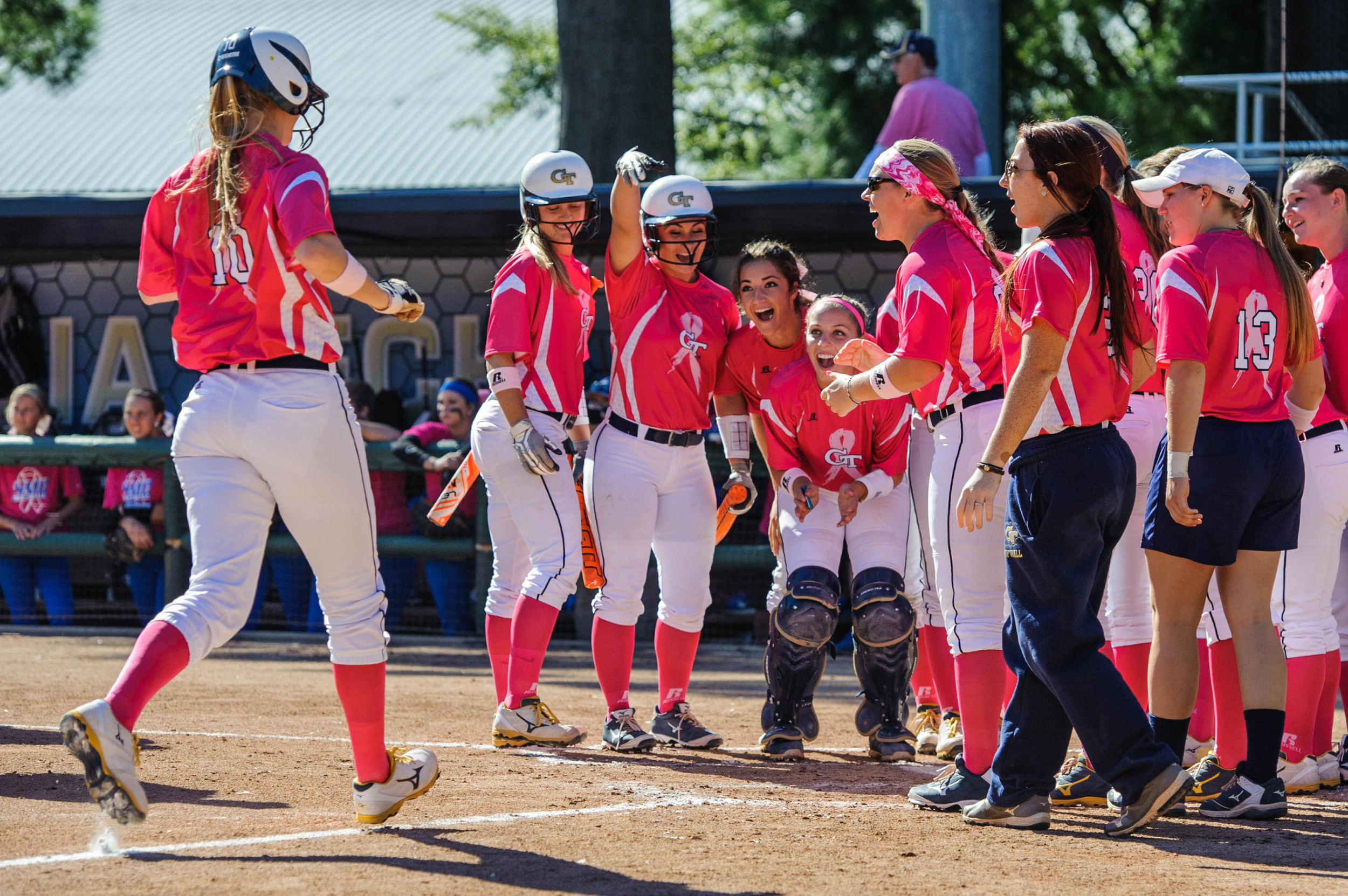 The team celebrates a home run by Kendall Chadwick (10)