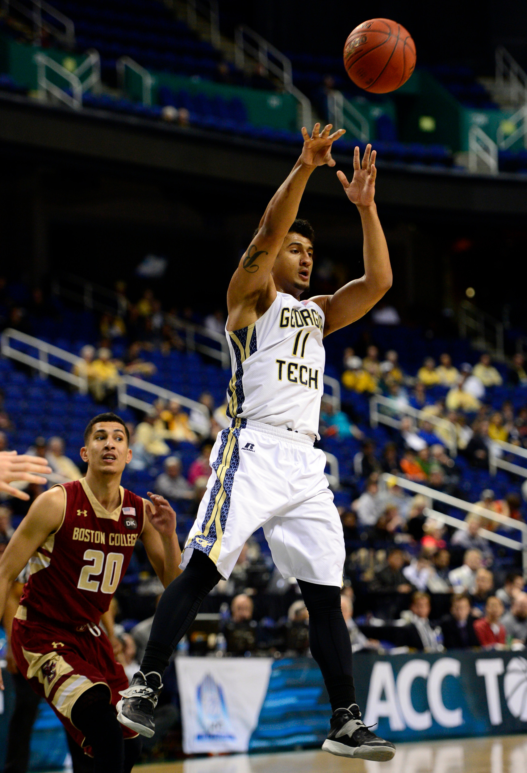 Mar 12, 2014; Greensboro, NC, USA; Georgia Tech Yellow Jackets guard Chris Bolden (11) passes a rebound back out against the Boston College Eagles during the first round of the ACC Tournament at Greensboro Coliseum. Mandatory Credit: John David Mercer-USA TODAY Sports