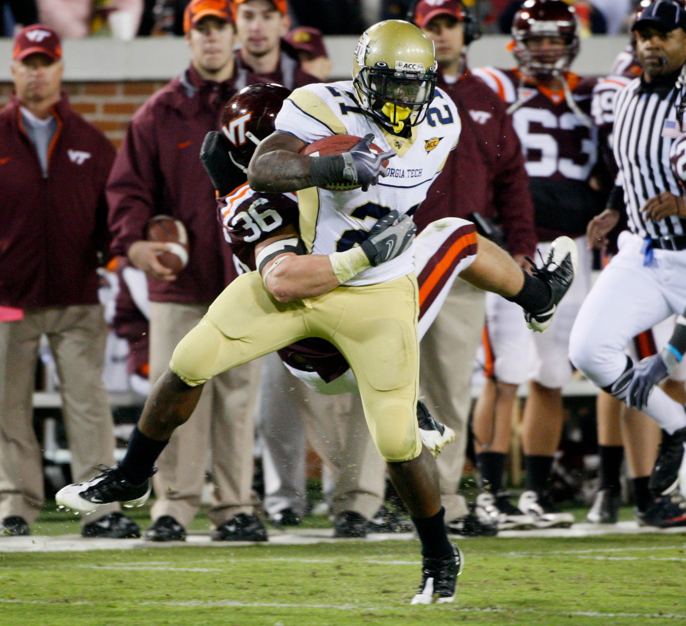 Georgia Tech running back Jonathan Dwyer (21) is stopped by Virginia Tech defender Jake Johnson in the third quarter of an NCAA college football game in Atlanta, Saturday, Oct. 17, 2009. Georgia Tech won 28-23. (AP Photo/John Bazemore)
