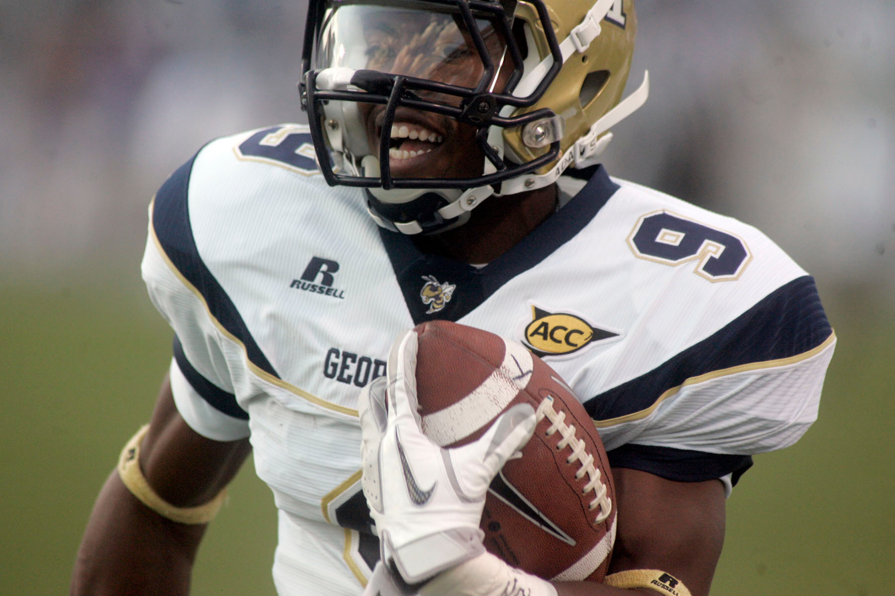 Georgia Tech's Tony Zenon smiles as he races down the sideline for a touchdown on the first play from scrimmage against Middle Tennessee during an NCAA college football game, Saturday, Sept. 10, 2011, in Murfreesboro, Tenn. (AP Photo/The Daily News Journal, Aaron Thompson)