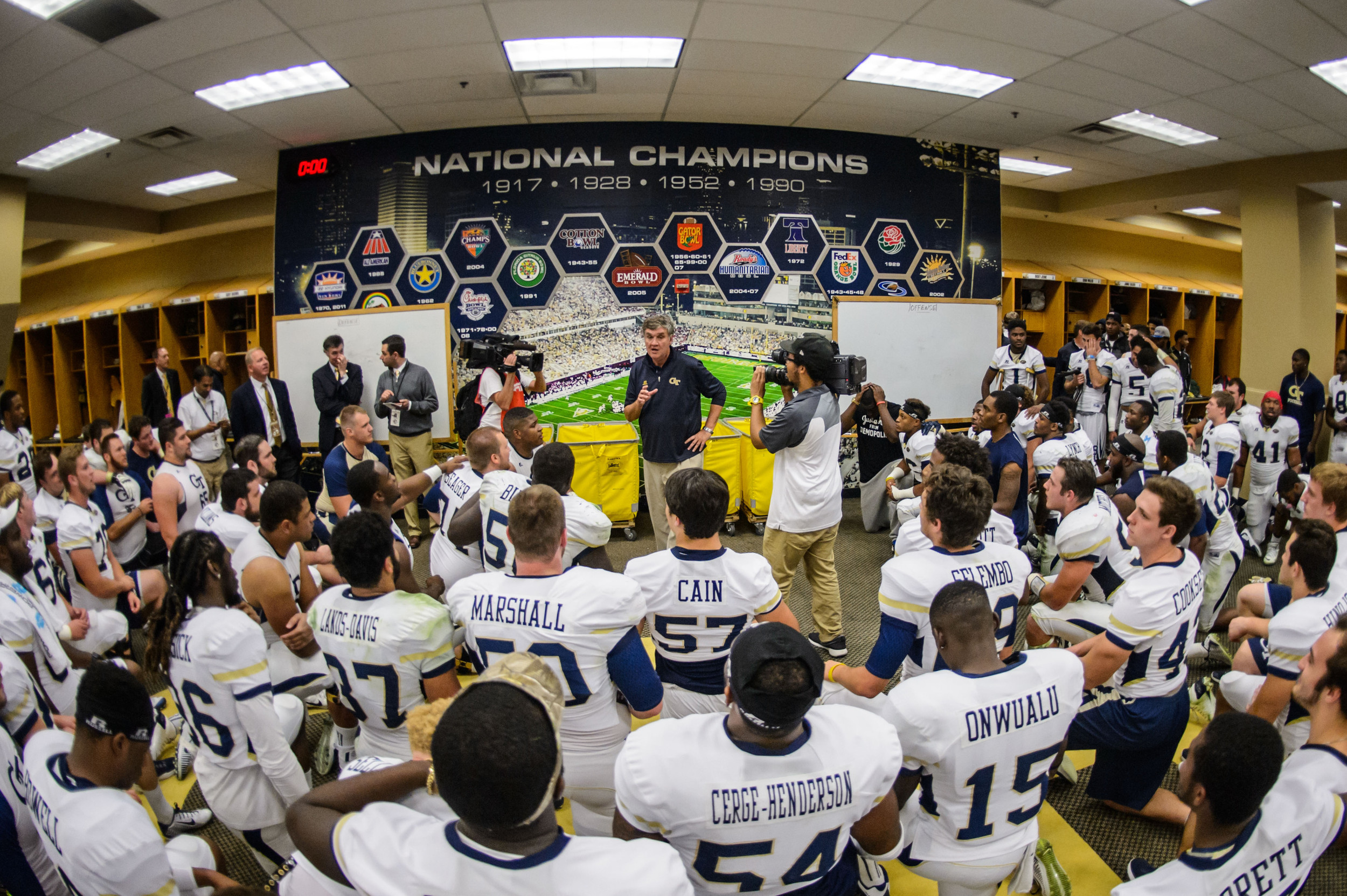 Coach Paul Johnson talks to the team after the upset victory