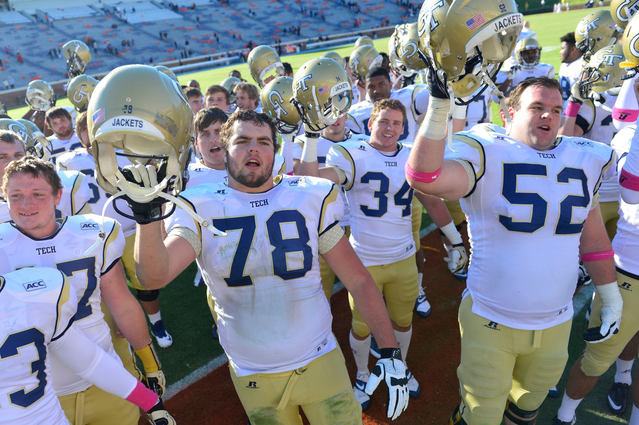 Georgia Tech Yellow Jackets players including offensive linesman Trey Braun (78) and running back Matt Connors (34) and Georgia Tech Yellow Jackets offensive linesman Will Jackson (52) celebrate after the game. Mandatory Credit: Bob Donnan-USA TODAY Sports