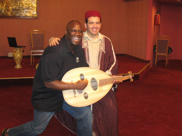 Assistant Coach Gene Hill with the guitar legend of Tunisia