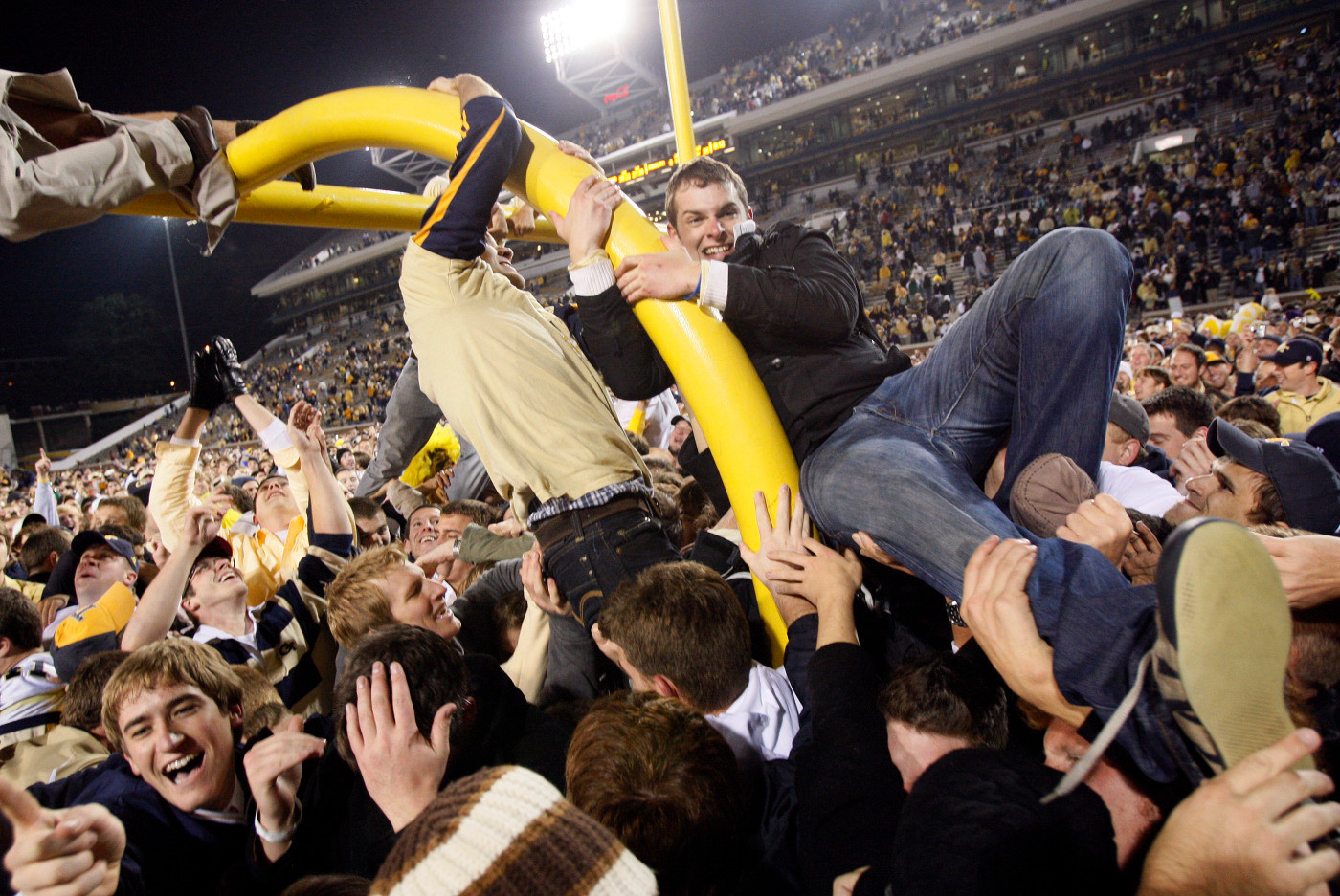 Georgia Tech students tear down the goalpost after the Yellow Jackets' 28-23 win over Virginia Tech in an NCAA college football game in Atlanta, Saturday, Oct. 17, 2009. (AP Photo/John Bazemore)