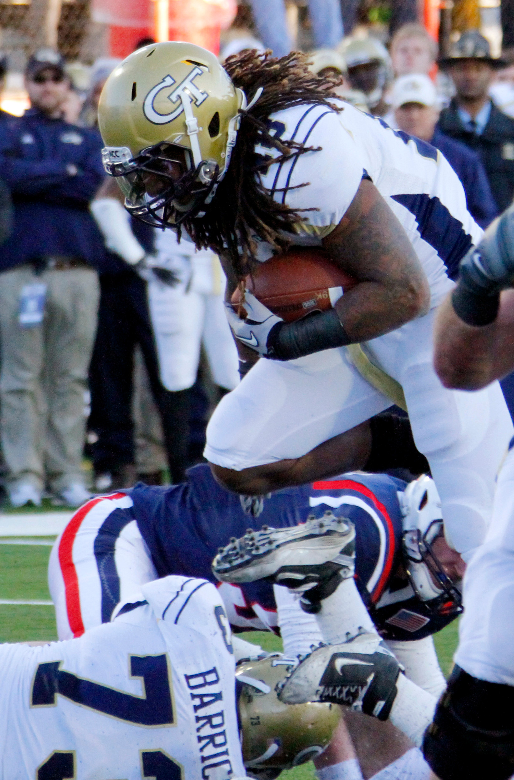 Georgia Tech running back Anthony Allen (18) leaps past Air Force defenders for a late-first-quarter touchdown during the Independence Bowl NCAA college football game in Shreveport, La., Monday, Dec. 27, 2010. (AP Photo/Rogelio V. Solis)