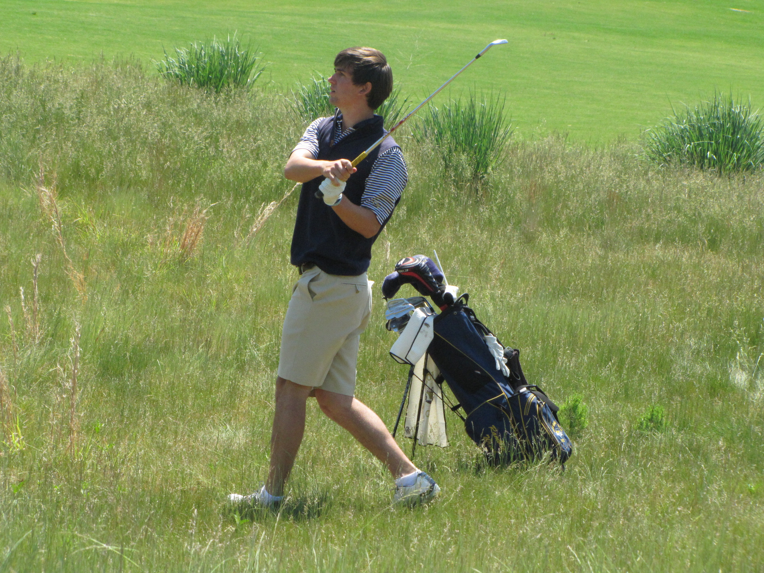 Ollie Schniederjans hits from the rough at the 9th hole during the final round of the NCAA Raleigh Regional.