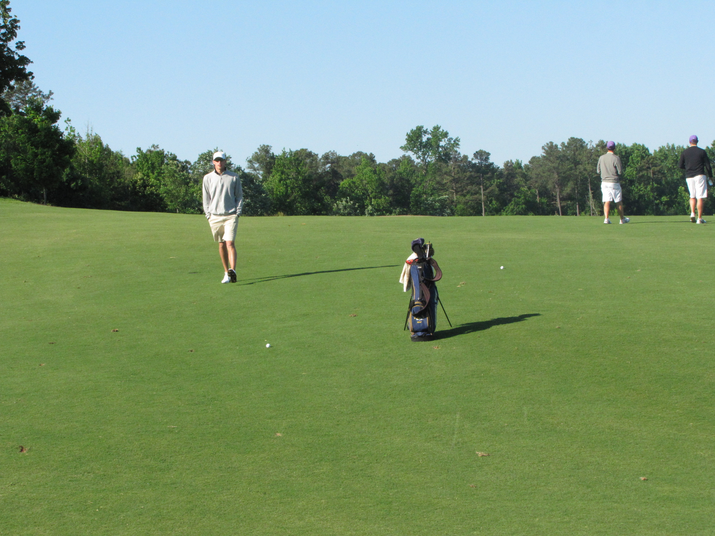 Richy Werenski walks back to his ball after getting a line to the green during the final round of the NCAA Raleigh Regional.