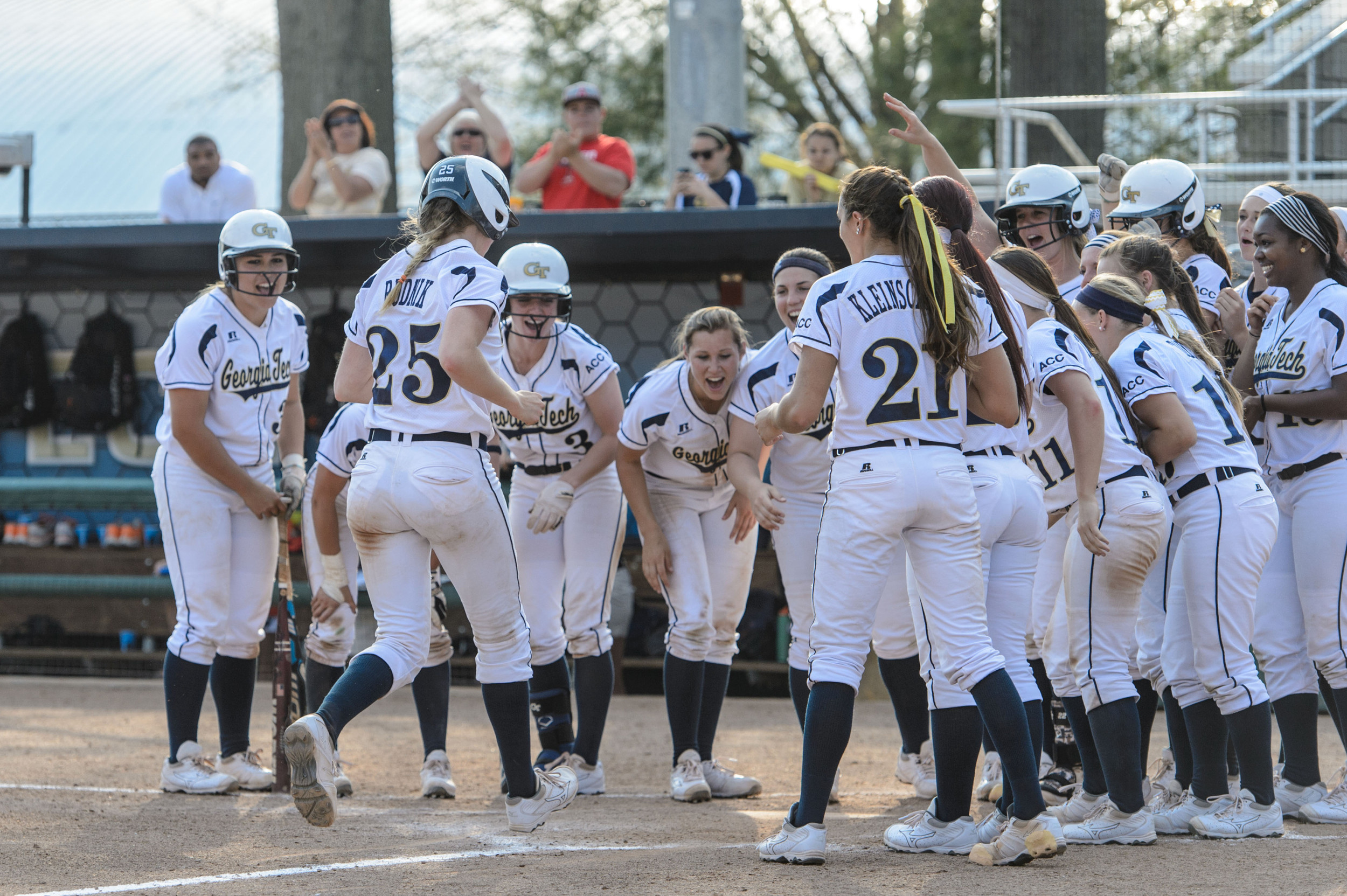 The team celebrates Alysha Rudnik's (25) home run