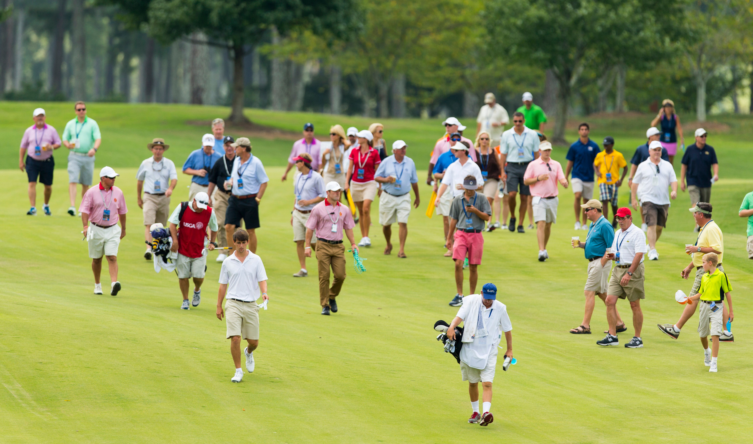 Ollie Schniederjans walks down the fairway on the first hole during the third round of match play at the 2014 U.S. Amateur at Atlanta Athletic Club in Johns Creek, Ga. on Thursday, Aug. 14, 2014. (Copyright USGA/Chris Keane)