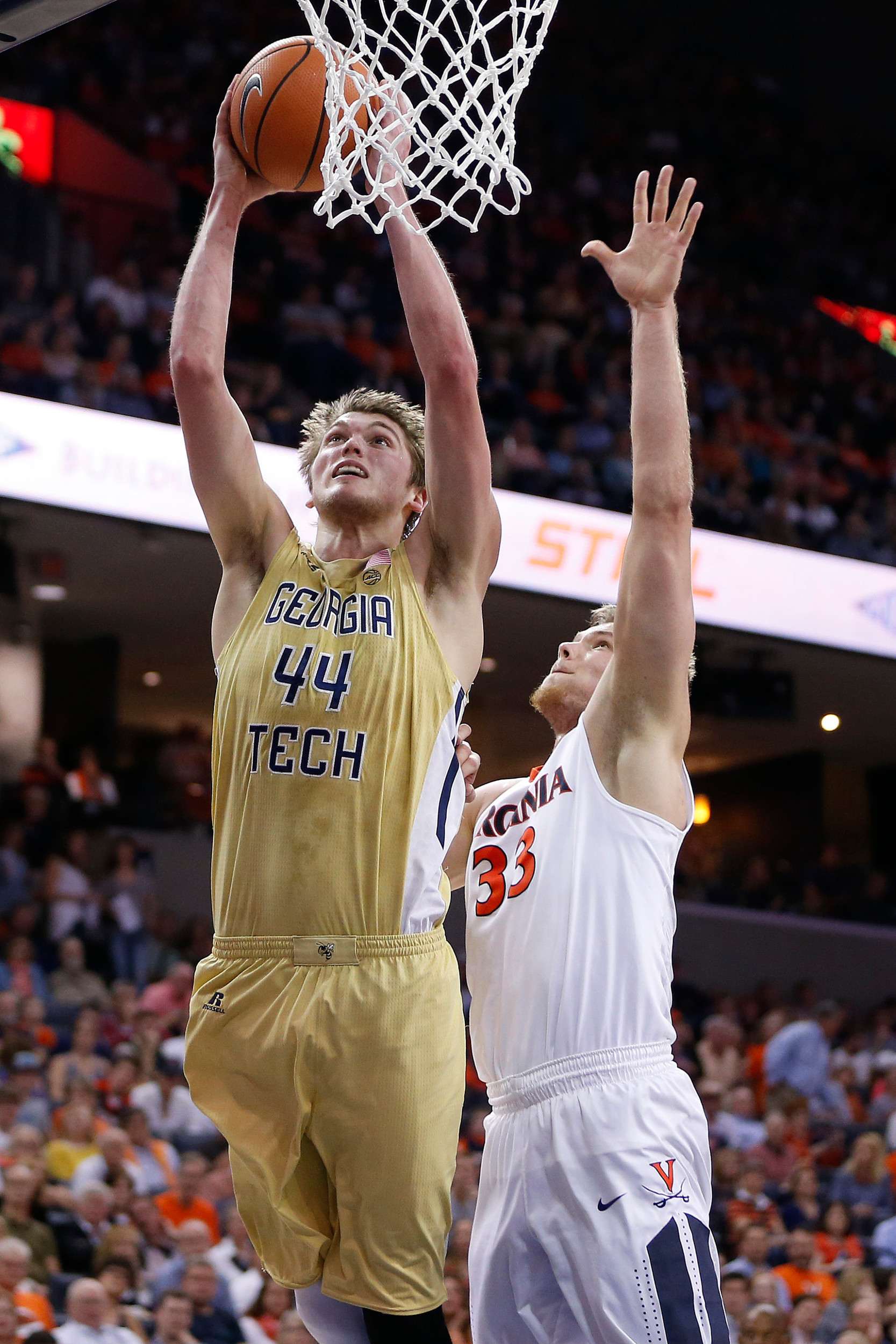 Feb 21, 2018; Charlottesville, VA, USA; Georgia Tech Yellow Jackets center Ben Lammers (44) shoots the ball past Virginia Cavaliers center Jack Salt (33) during the first half at John Paul Jones Arena. Mandatory Credit: Amber Searls-USA TODAY Sports