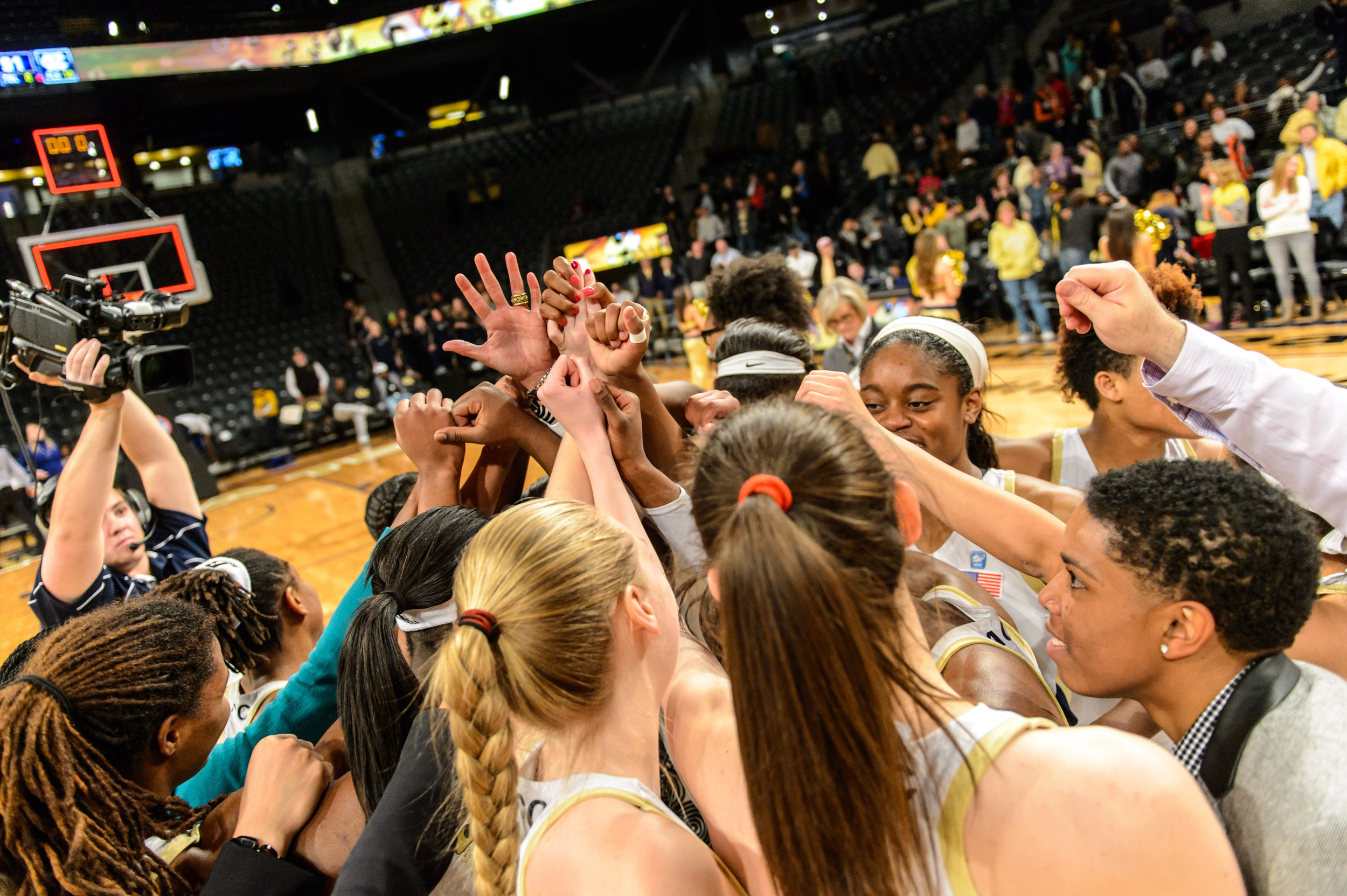 Team huddle after the upset over #13 UNC