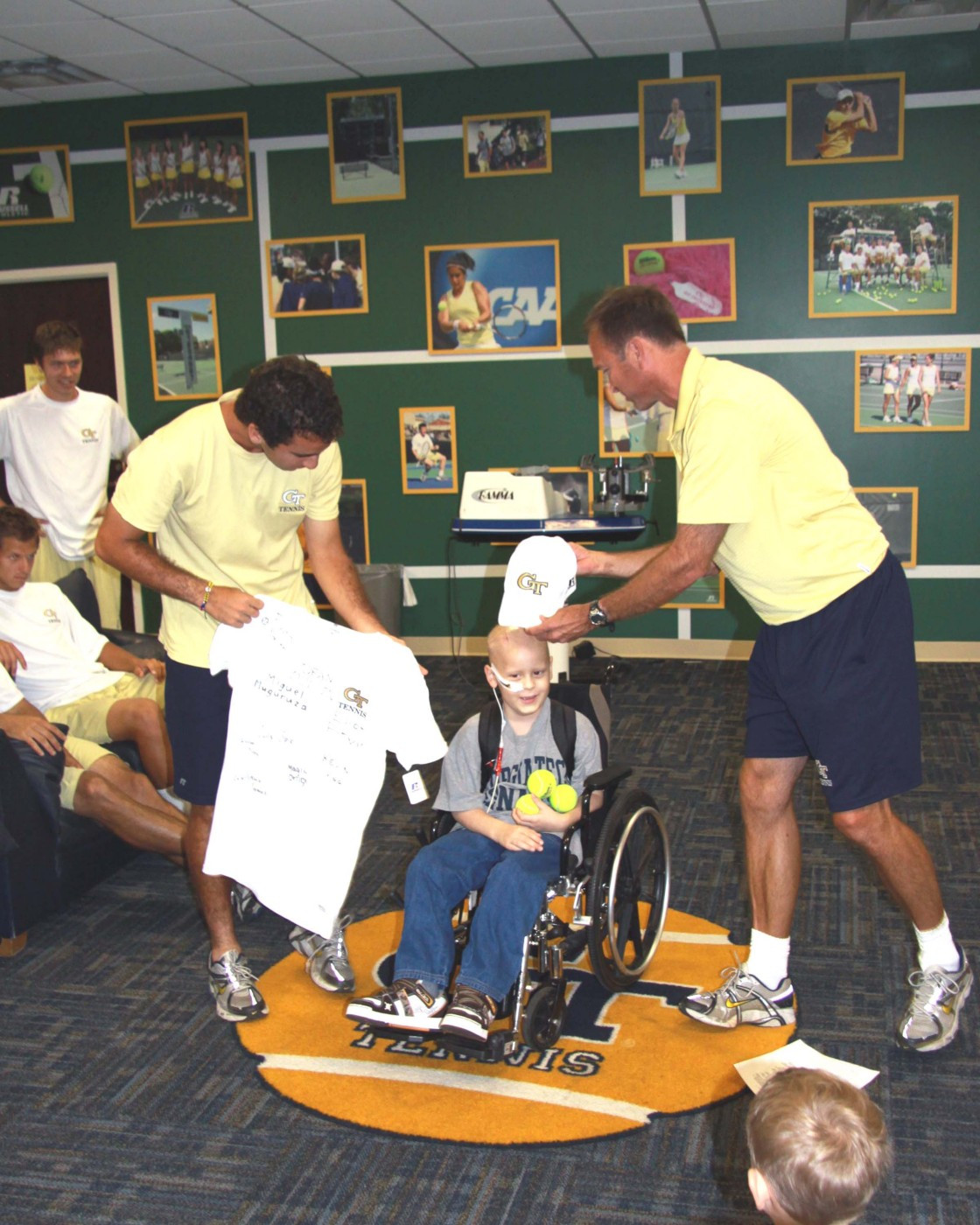 Magin Ortiga presents Nolan with a signed team jersey.