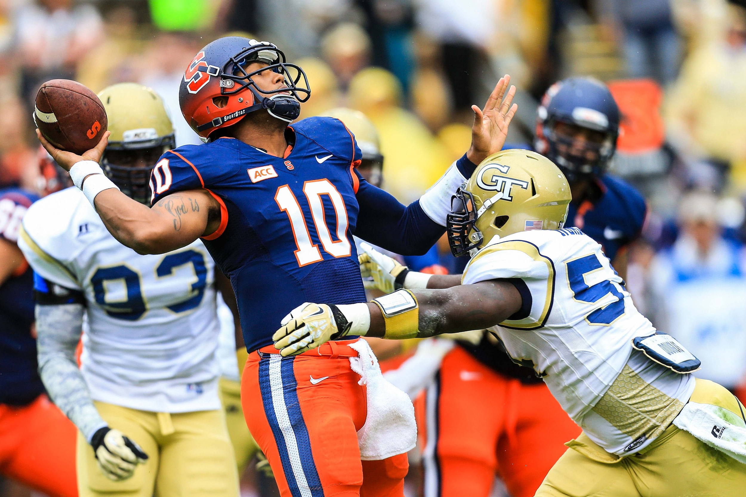 Terrel Hunt (10) is hit as he throws by Georgia Tech Yellow Jackets linebacker Quayshawn Nealy (54). Mandatory Credit: Daniel Shirey-USA TODAY Sports