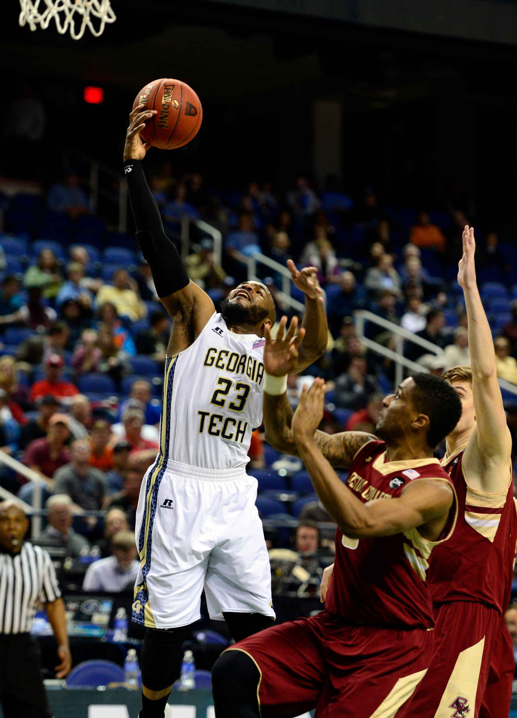Mar 12, 2014; Greensboro, NC, USA; Georgia Tech Yellow Jackets guard Trae Golden (23) looses the ball as he goes up for a layup against the Boston College Eagles during the first round of the ACC Tournament at Greensboro Coliseum. Mandatory Credit: John David Mercer-USA TODAY Sports